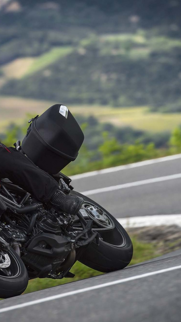 Man in Black and Red Motorcycle Suit Riding on Red Sports Bike on Road During Daytime. Wallpaper in 720x1280 Resolution