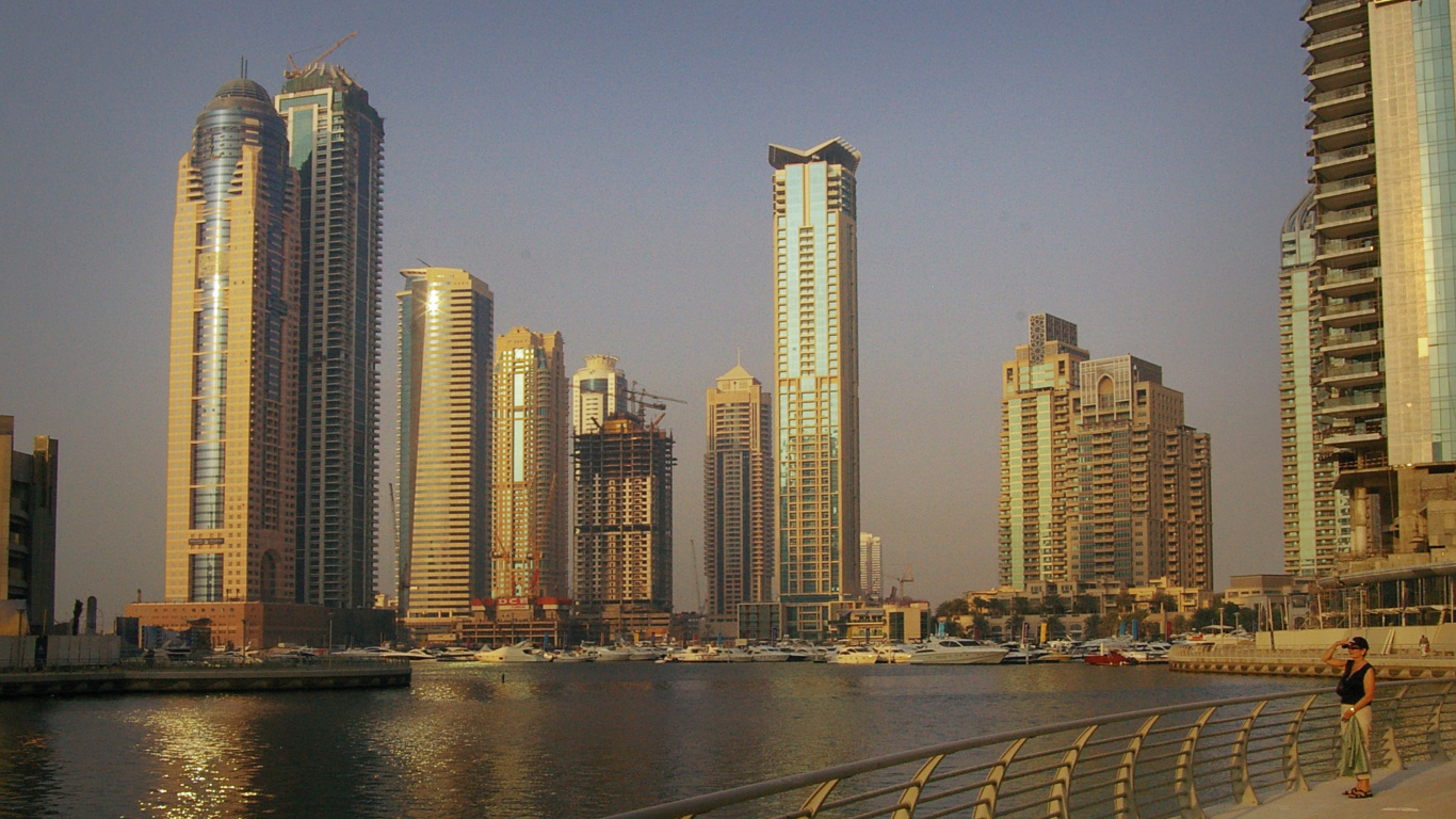 City Skyline Across Body of Water During Daytime. Wallpaper in 1366x768 Resolution