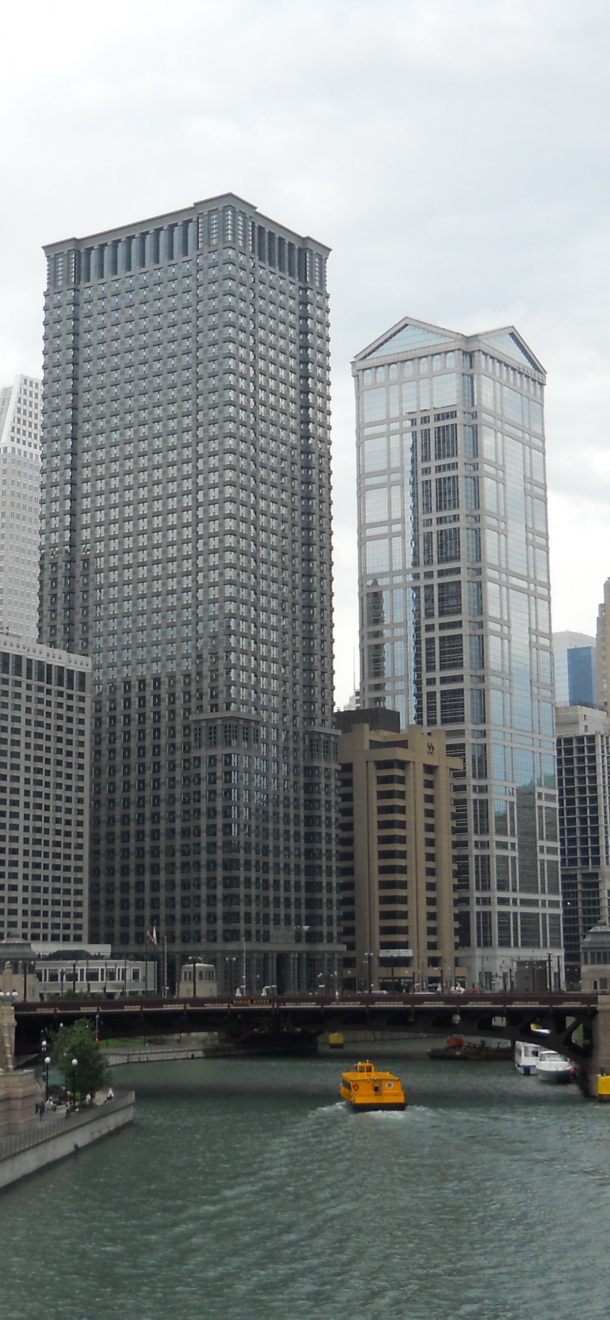 White and Gray Concrete Building Near Body of Water During Daytime. Wallpaper in 1242x2688 Resolution