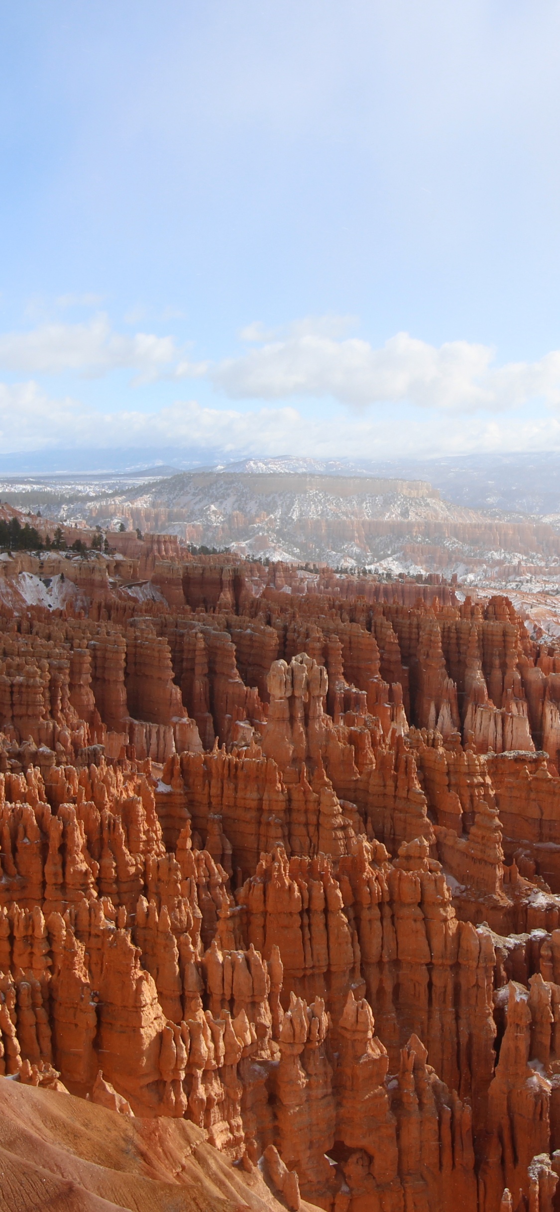 Brown Rock Formation Under White Clouds During Daytime. Wallpaper in 1125x2436 Resolution