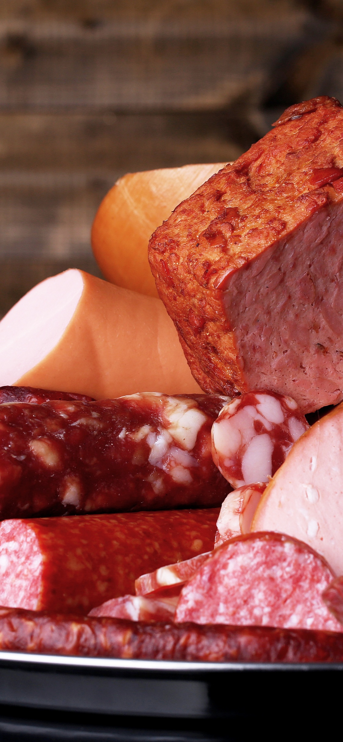 Sliced Meat on White Ceramic Plate. Wallpaper in 1125x2436 Resolution