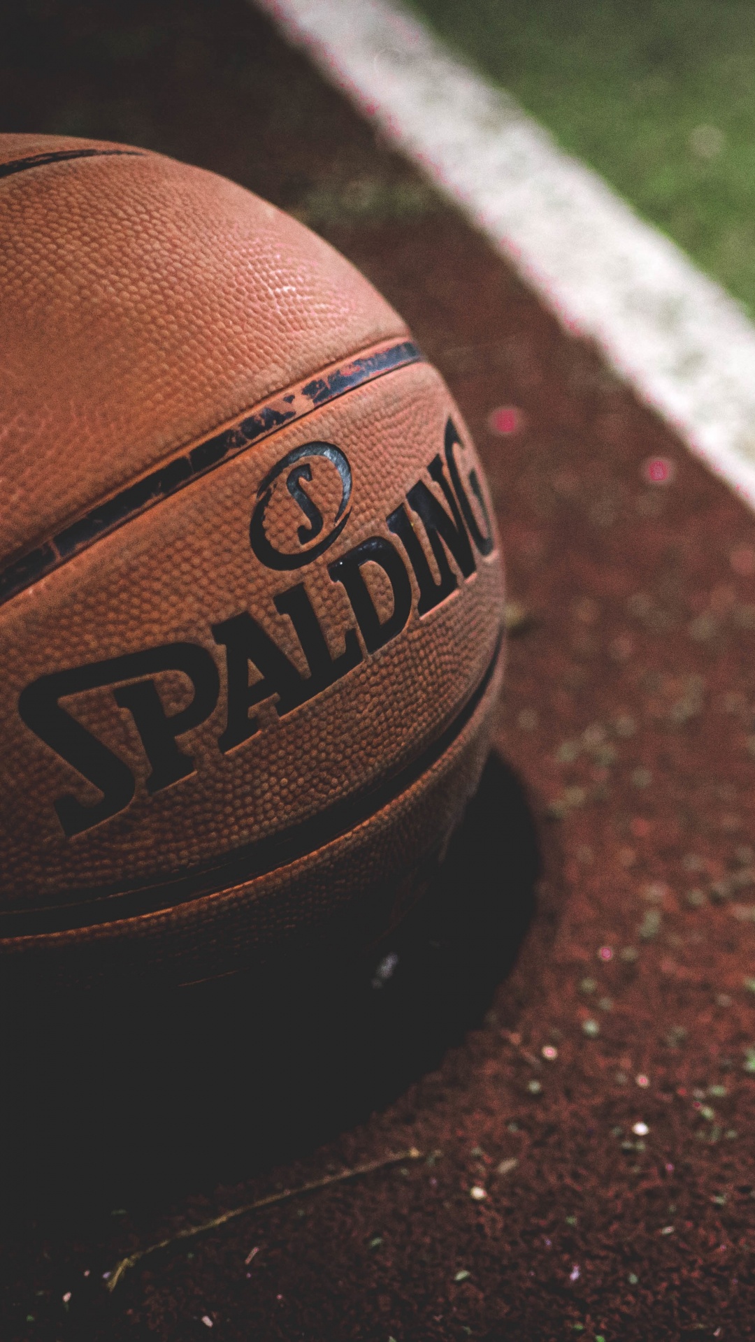 Brown and Black Basketball on Brown and White Concrete Floor. Wallpaper in 1080x1920 Resolution