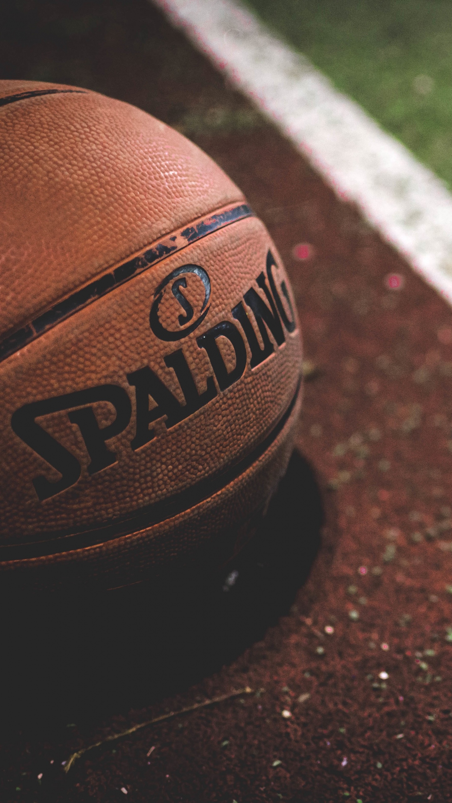 Brown and Black Basketball on Brown and White Concrete Floor. Wallpaper in 1440x2560 Resolution