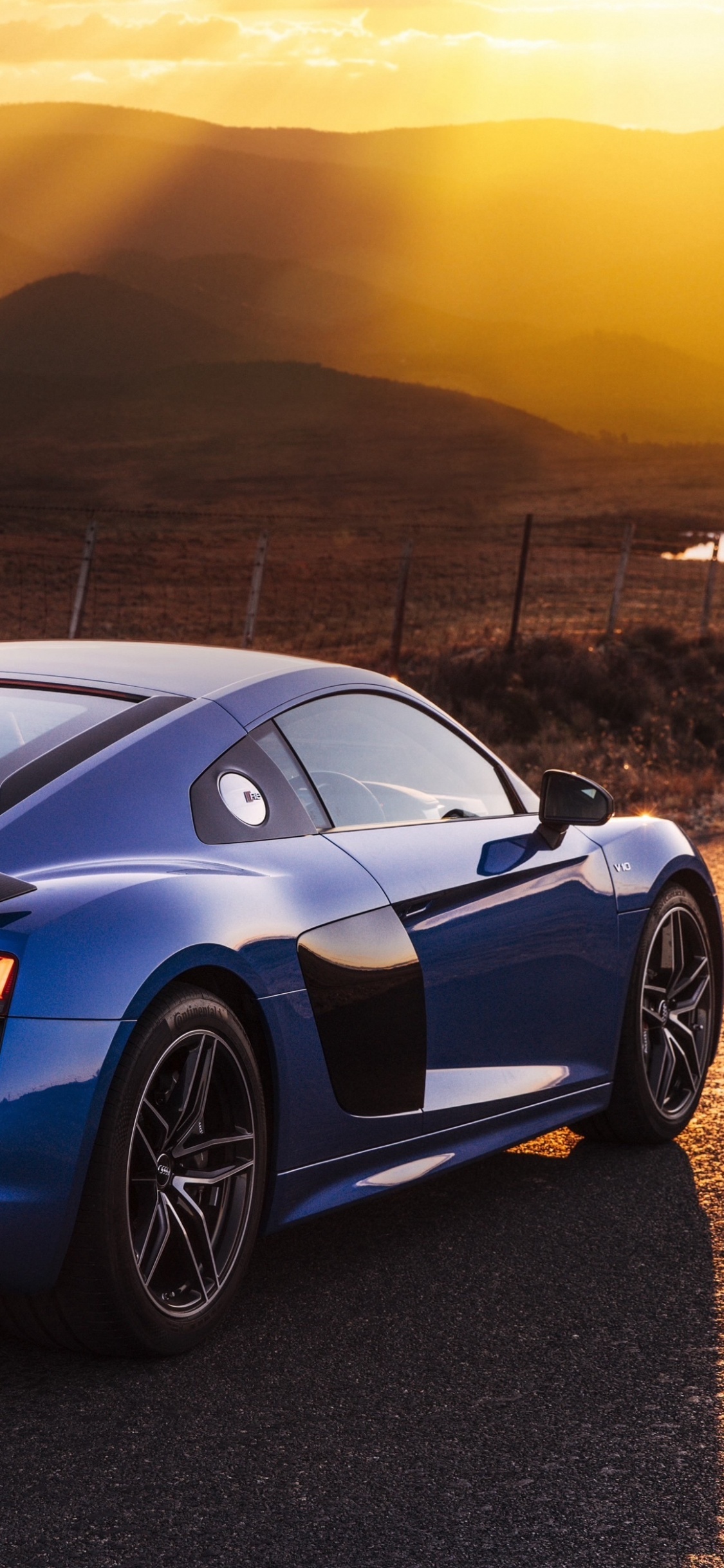 Blue Audi r 8 on Road During Daytime. Wallpaper in 1125x2436 Resolution