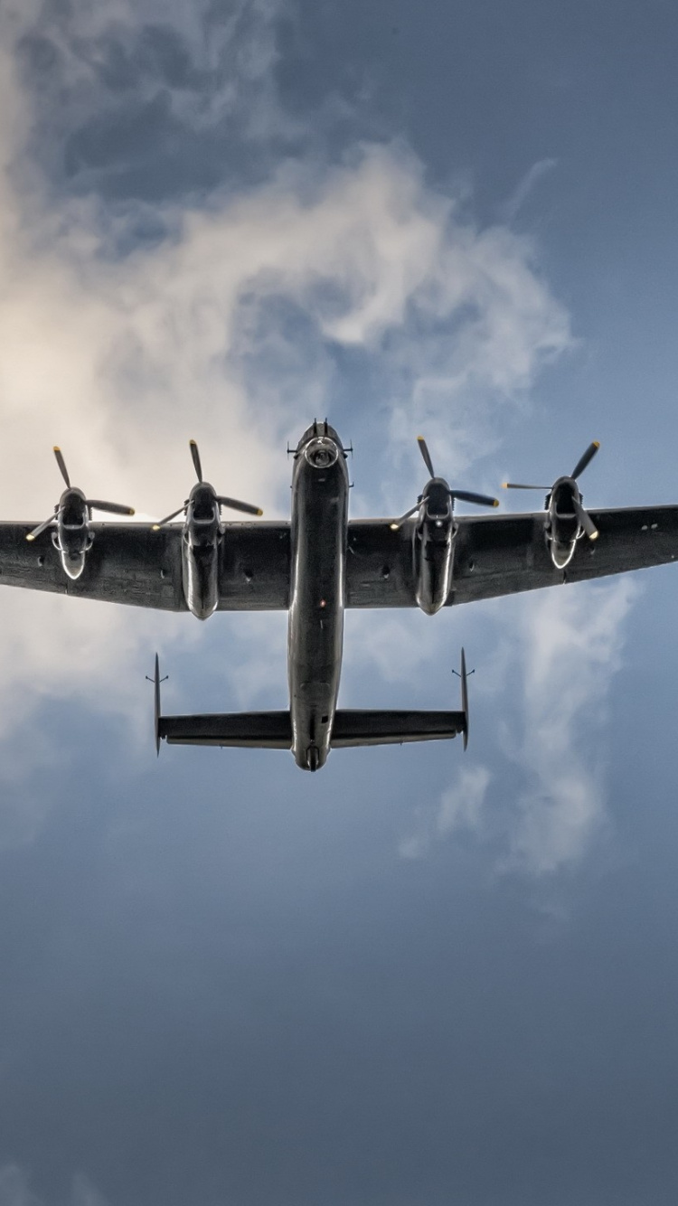 Avión Jet Negro en el Aire Durante el Día. Wallpaper in 750x1334 Resolution