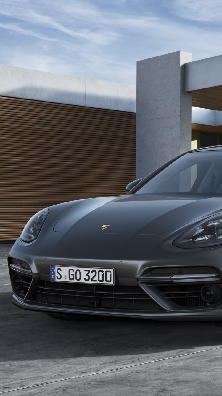 Black Mercedes Benz Coupe Parked Near Brown Building. Wallpaper in 750x1334 Resolution