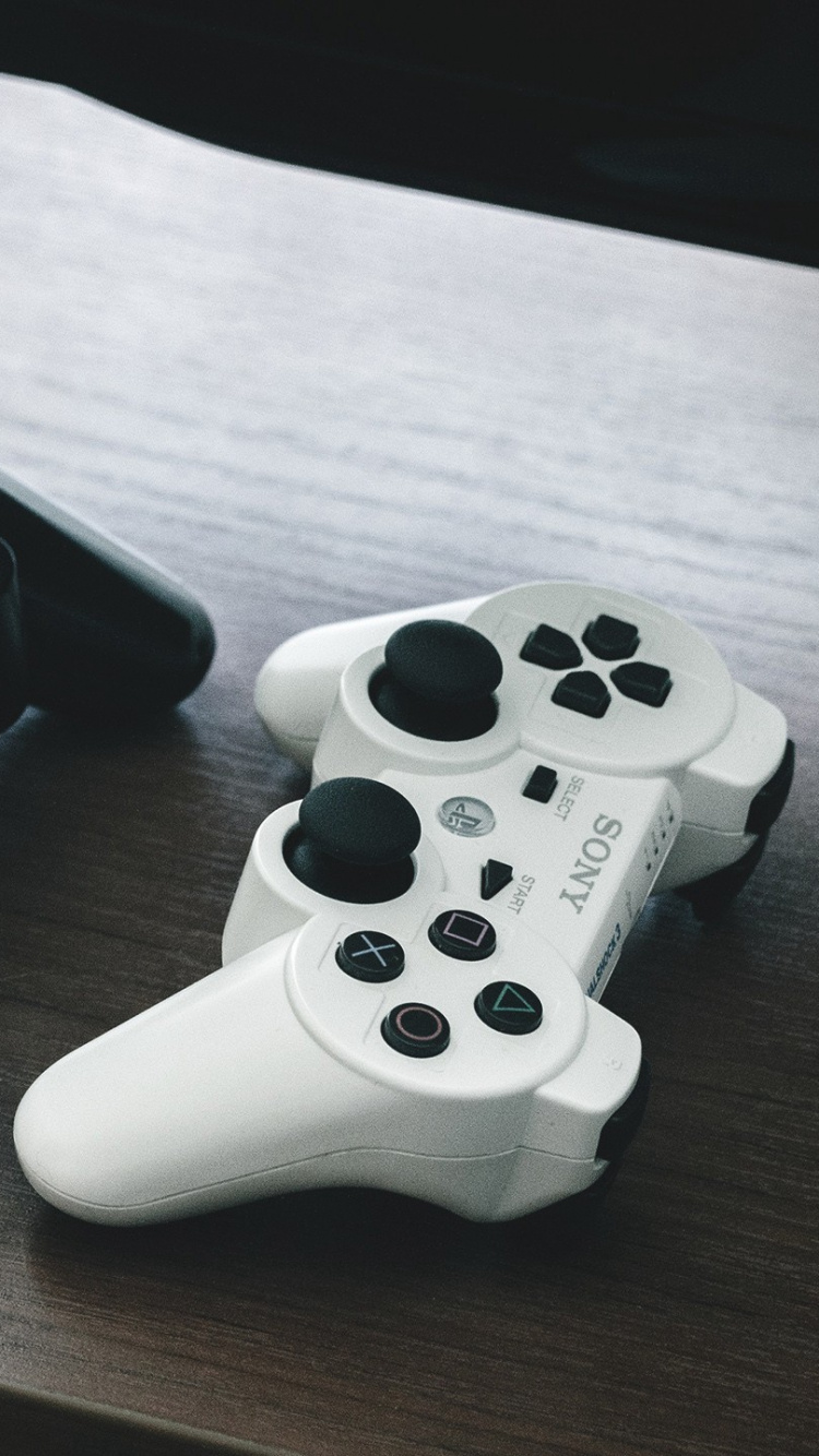 White Sony ps 4 Game Controller. Wallpaper in 750x1334 Resolution