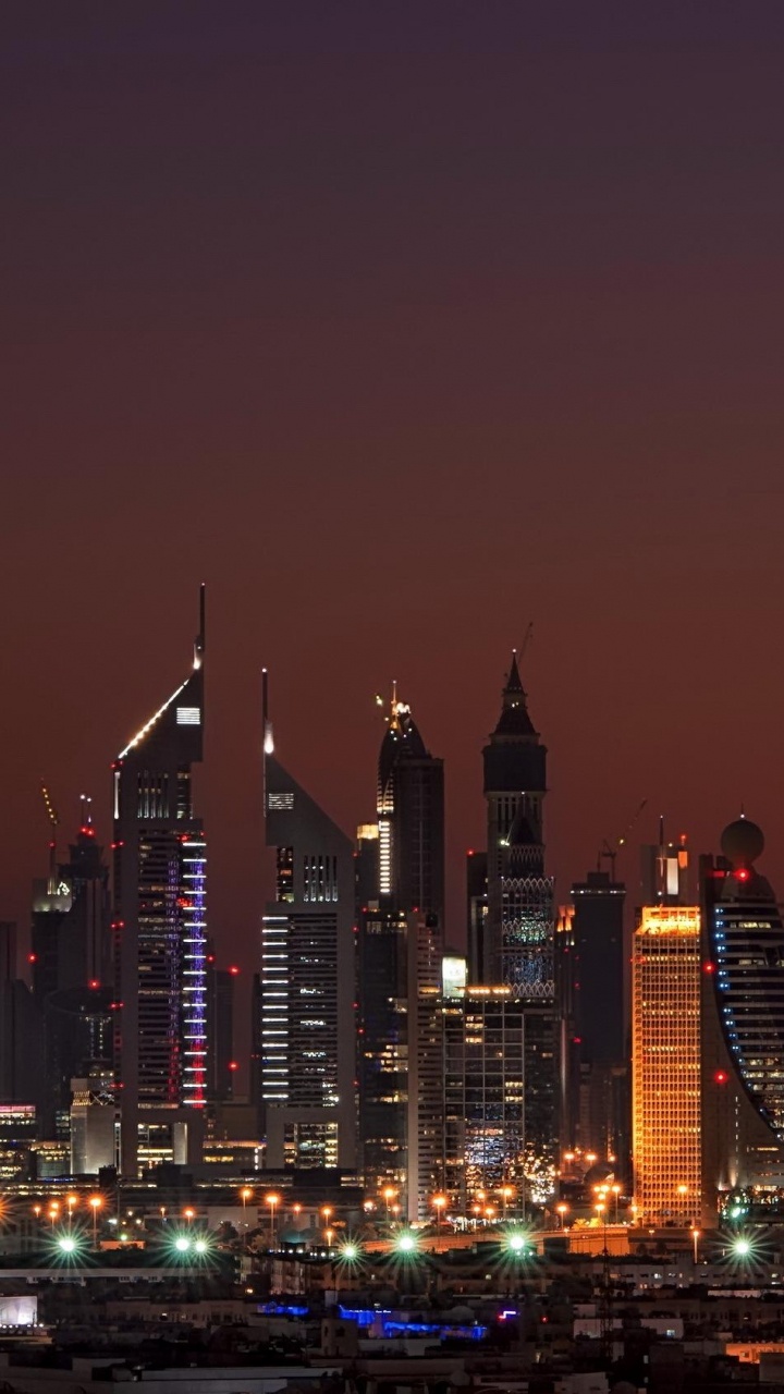 City Skyline During Night Time. Wallpaper in 720x1280 Resolution