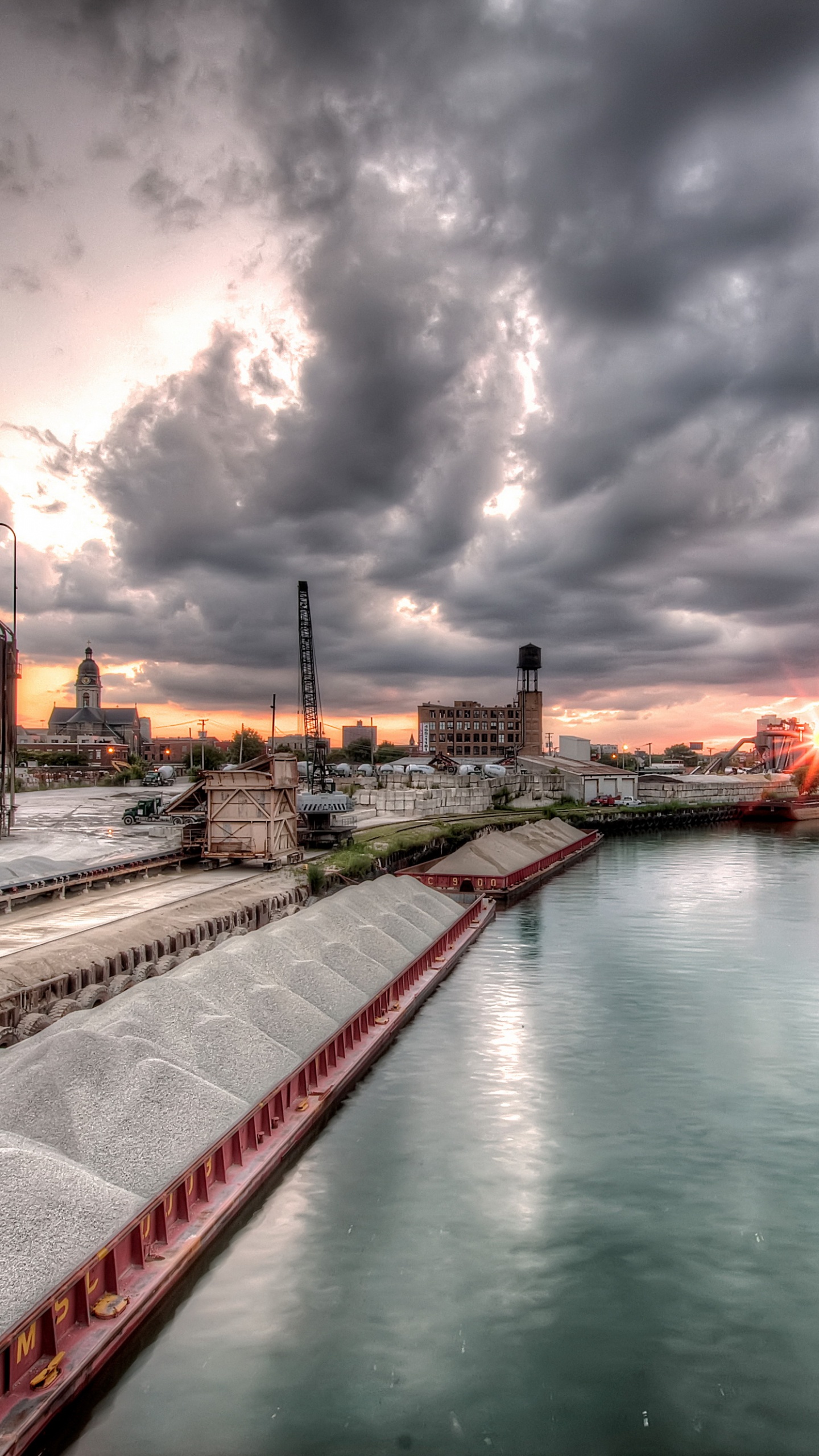 Body of Water Near Buildings Under Cloudy Sky During Daytime. Wallpaper in 1440x2560 Resolution