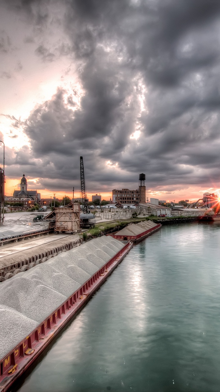 Body of Water Near Buildings Under Cloudy Sky During Daytime. Wallpaper in 720x1280 Resolution