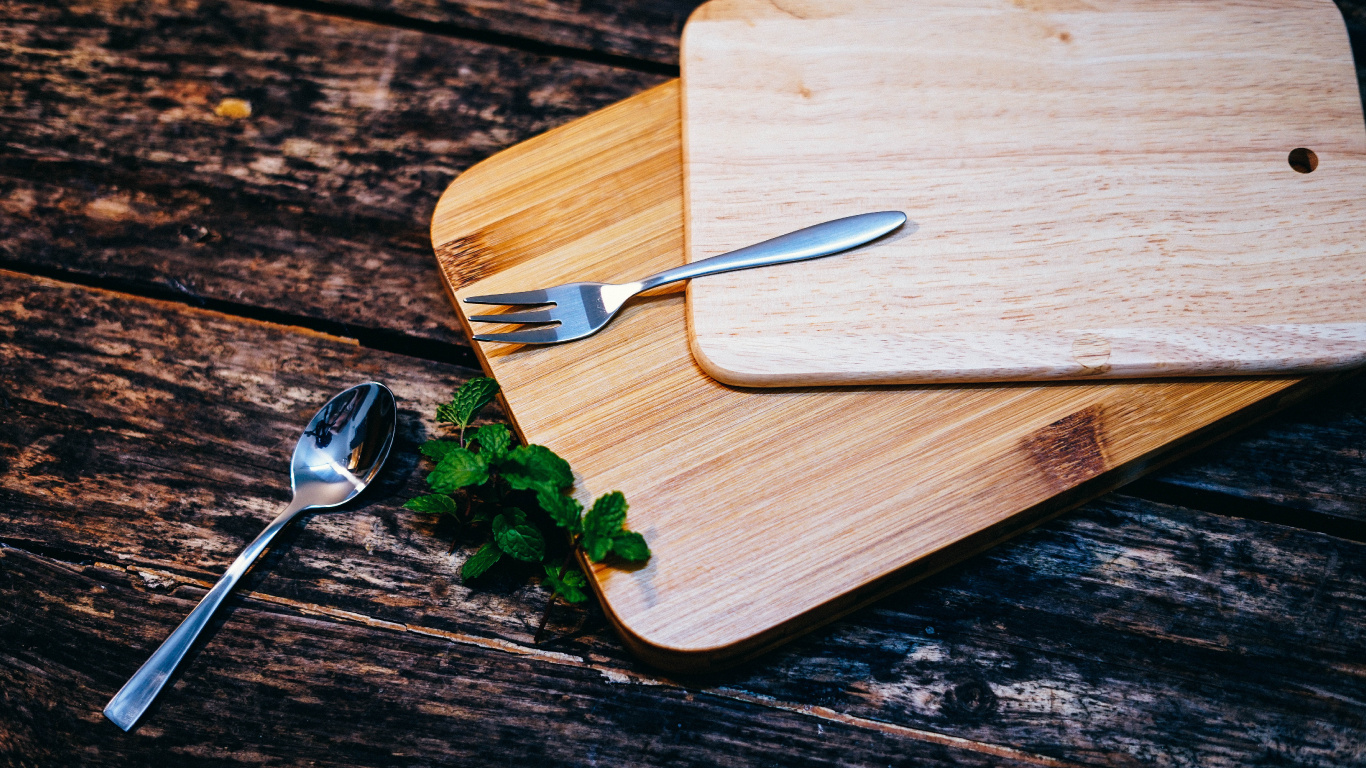 Stainless Steel Fork on Brown Wooden Chopping Board. Wallpaper in 1366x768 Resolution