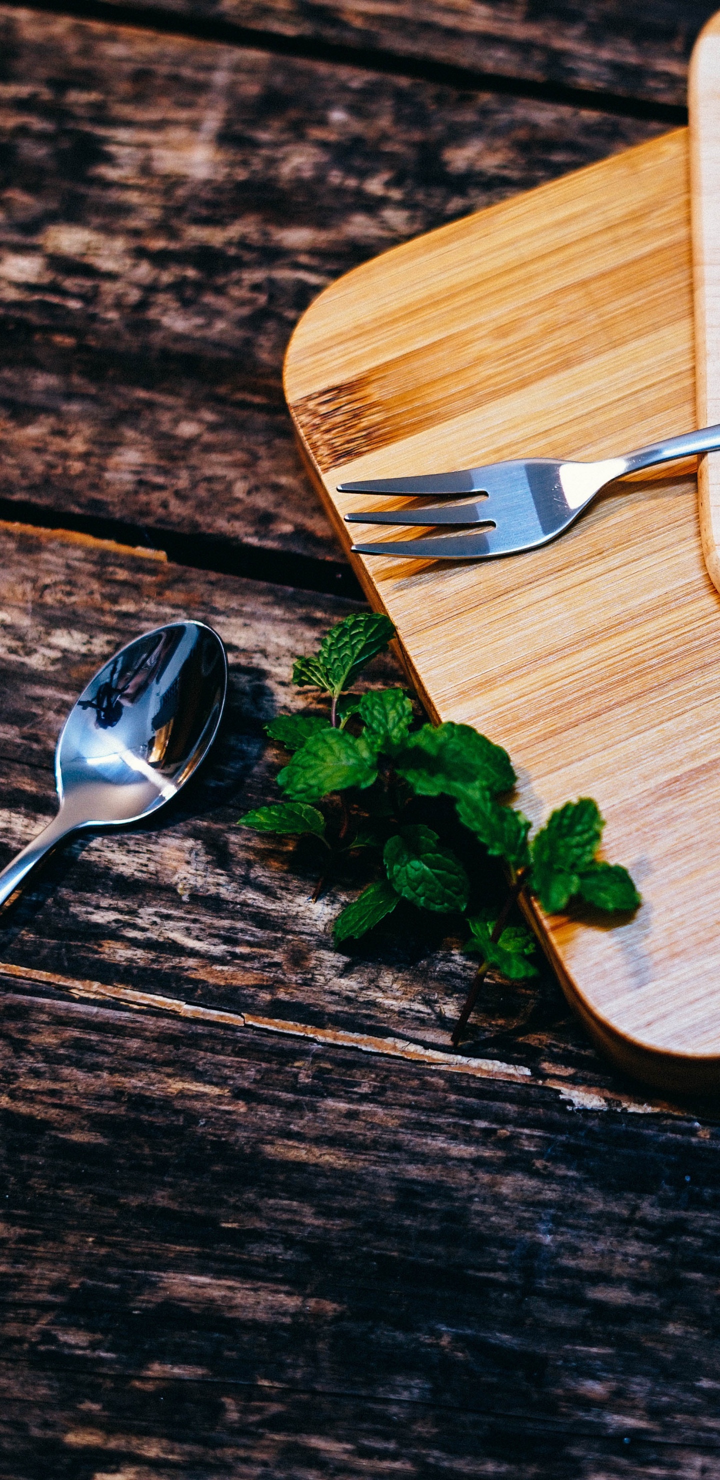 Stainless Steel Fork on Brown Wooden Chopping Board. Wallpaper in 1440x2960 Resolution