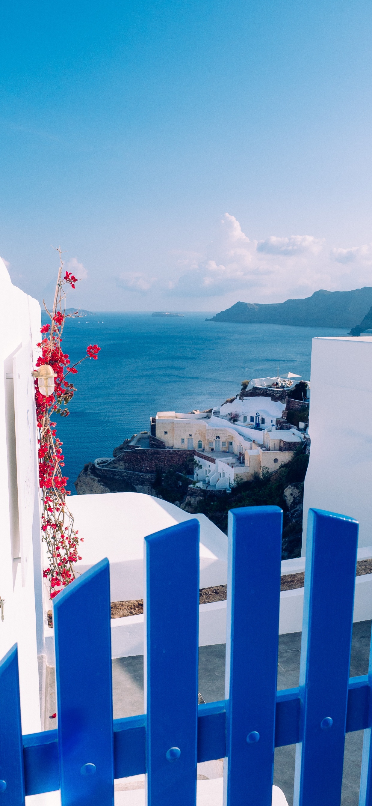 White and Blue Building Near Body of Water During Daytime. Wallpaper in 1242x2688 Resolution