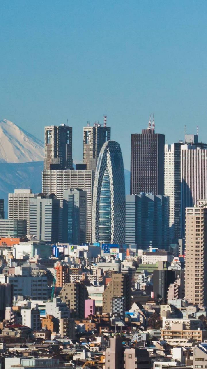 Horizonte de la Ciudad Bajo un Cielo Azul Durante el Día. Wallpaper in 720x1280 Resolution