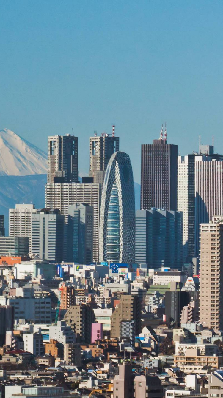 City Skyline Under Blue Sky During Daytime. Wallpaper in 750x1334 Resolution