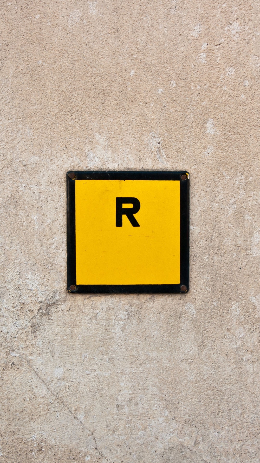 Yellow and Black 2 Print on Gray Concrete Wall. Wallpaper in 1080x1920 Resolution