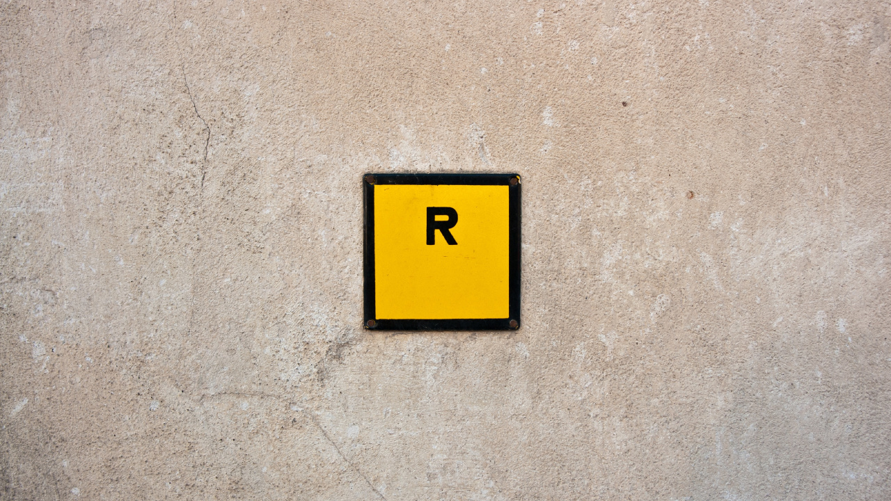 Yellow and Black 2 Print on Gray Concrete Wall. Wallpaper in 1280x720 Resolution