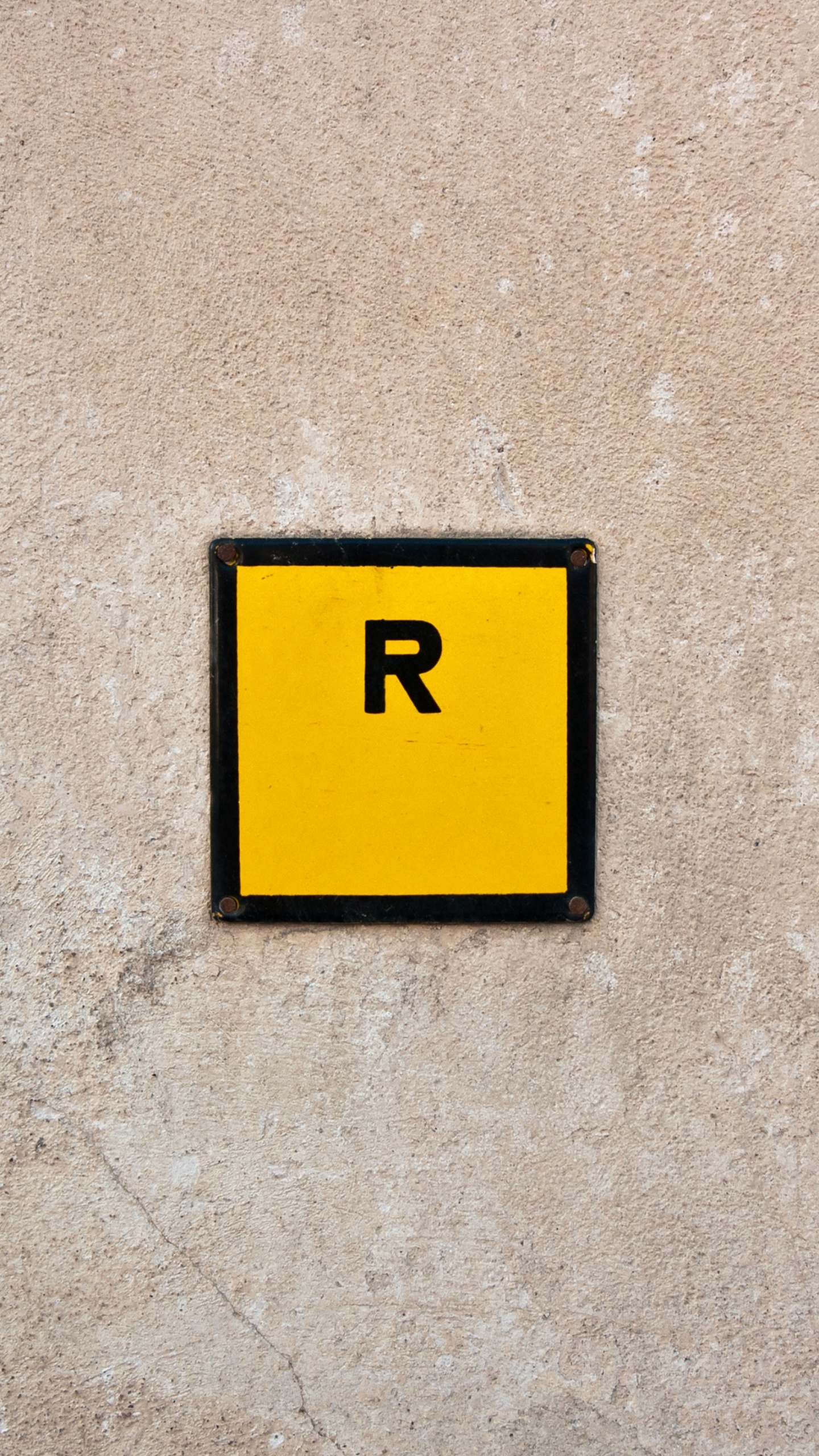 Yellow and Black 2 Print on Gray Concrete Wall. Wallpaper in 1440x2560 Resolution