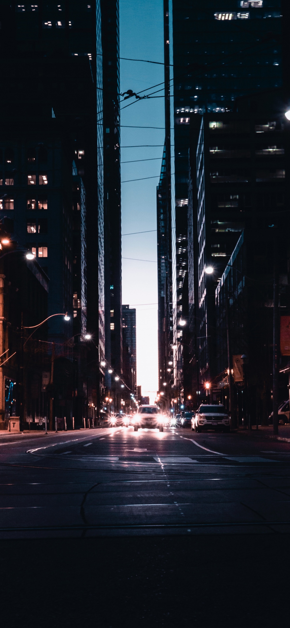 People Walking on Street During Night Time. Wallpaper in 1125x2436 Resolution