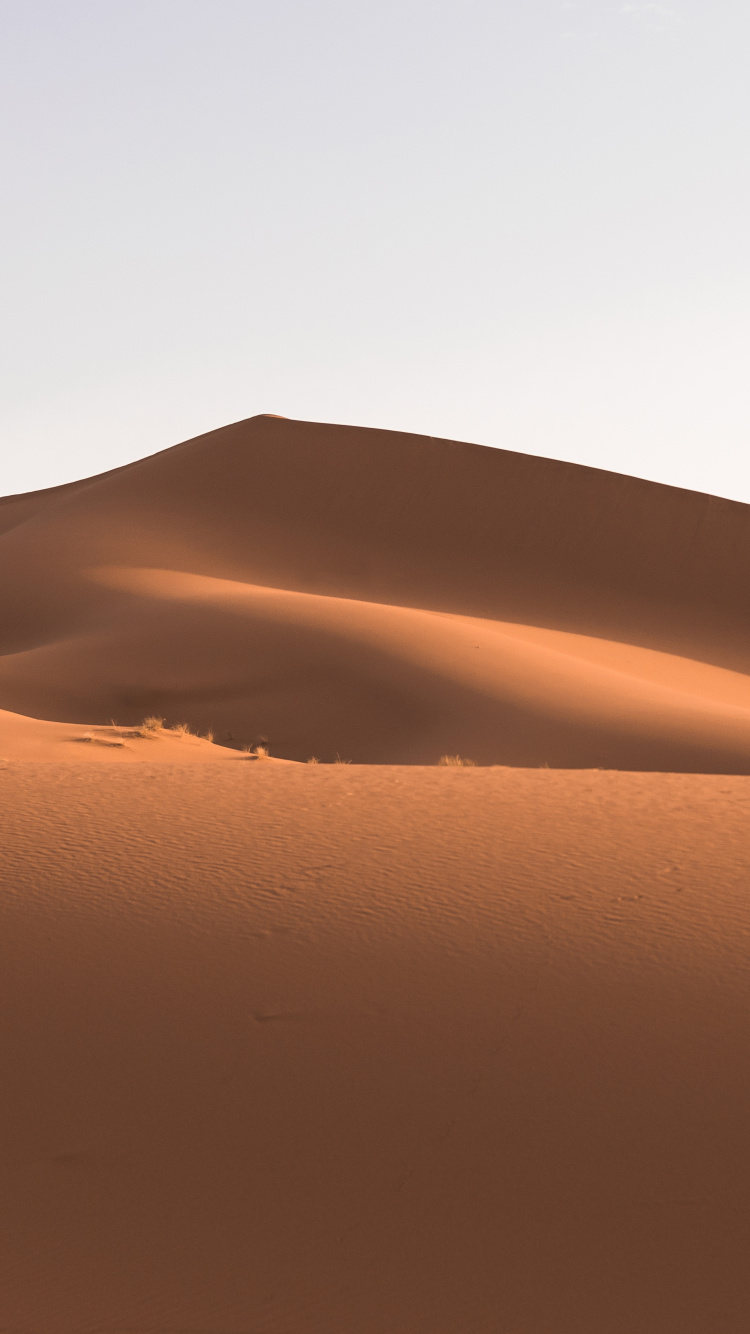 Desert Under Blue Sky During Daytime. Wallpaper in 750x1334 Resolution