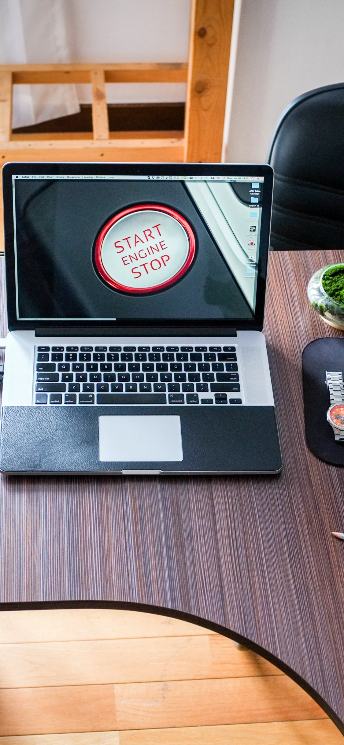 Macbook Pro on Brown Wooden Table. Wallpaper in 1125x2436 Resolution