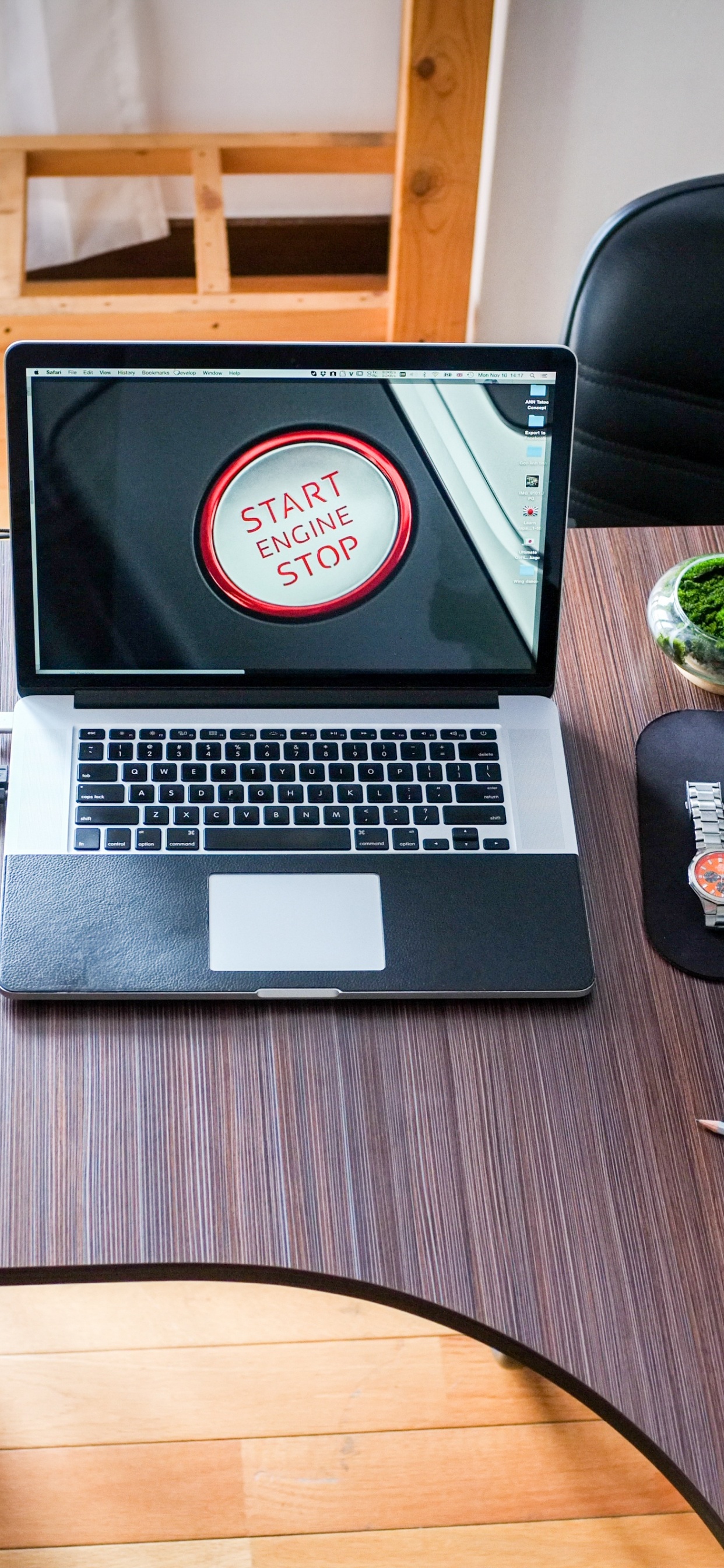 Macbook Pro on Brown Wooden Table. Wallpaper in 1242x2688 Resolution