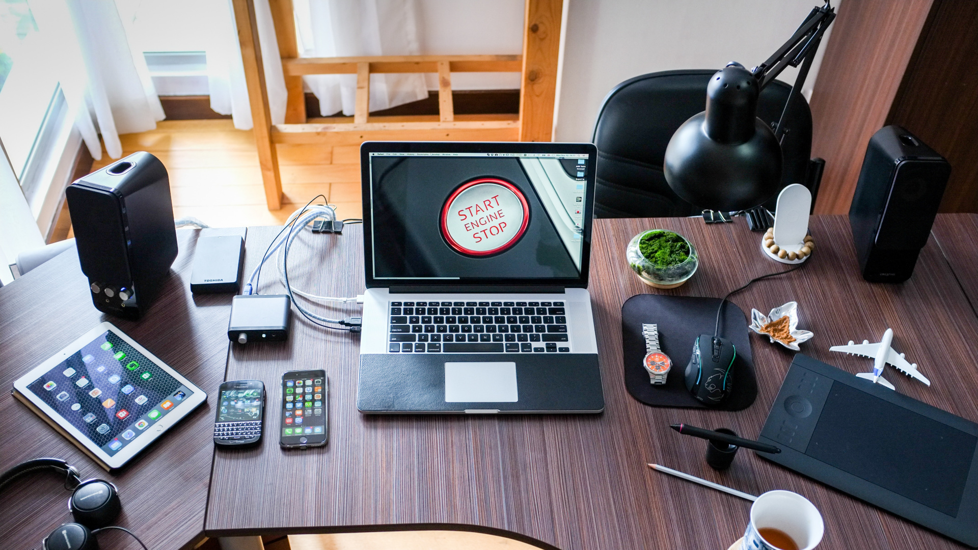 Macbook Pro on Brown Wooden Table. Wallpaper in 1920x1080 Resolution