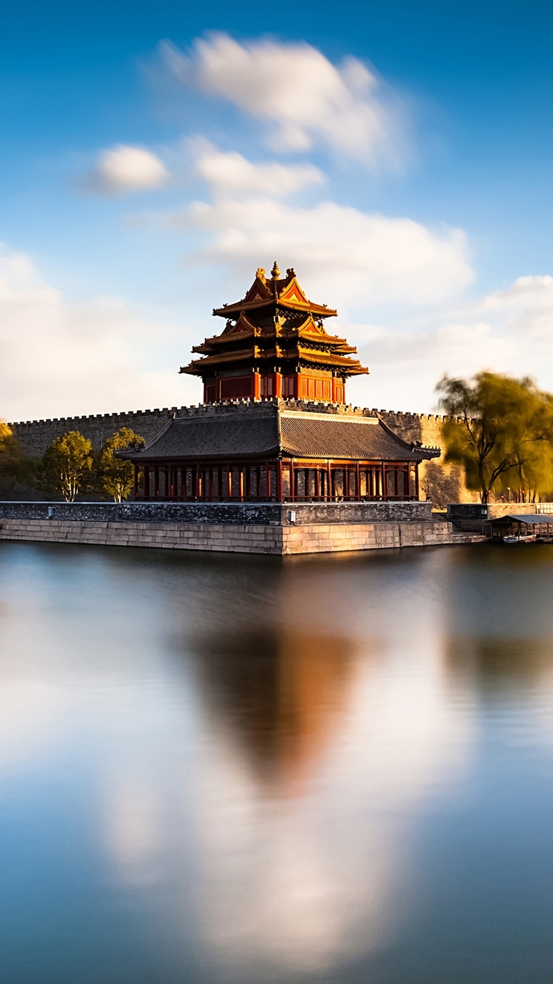 Brown Concrete Building Near Body of Water Under Blue Sky During Daytime. Wallpaper in 1080x1920 Resolution