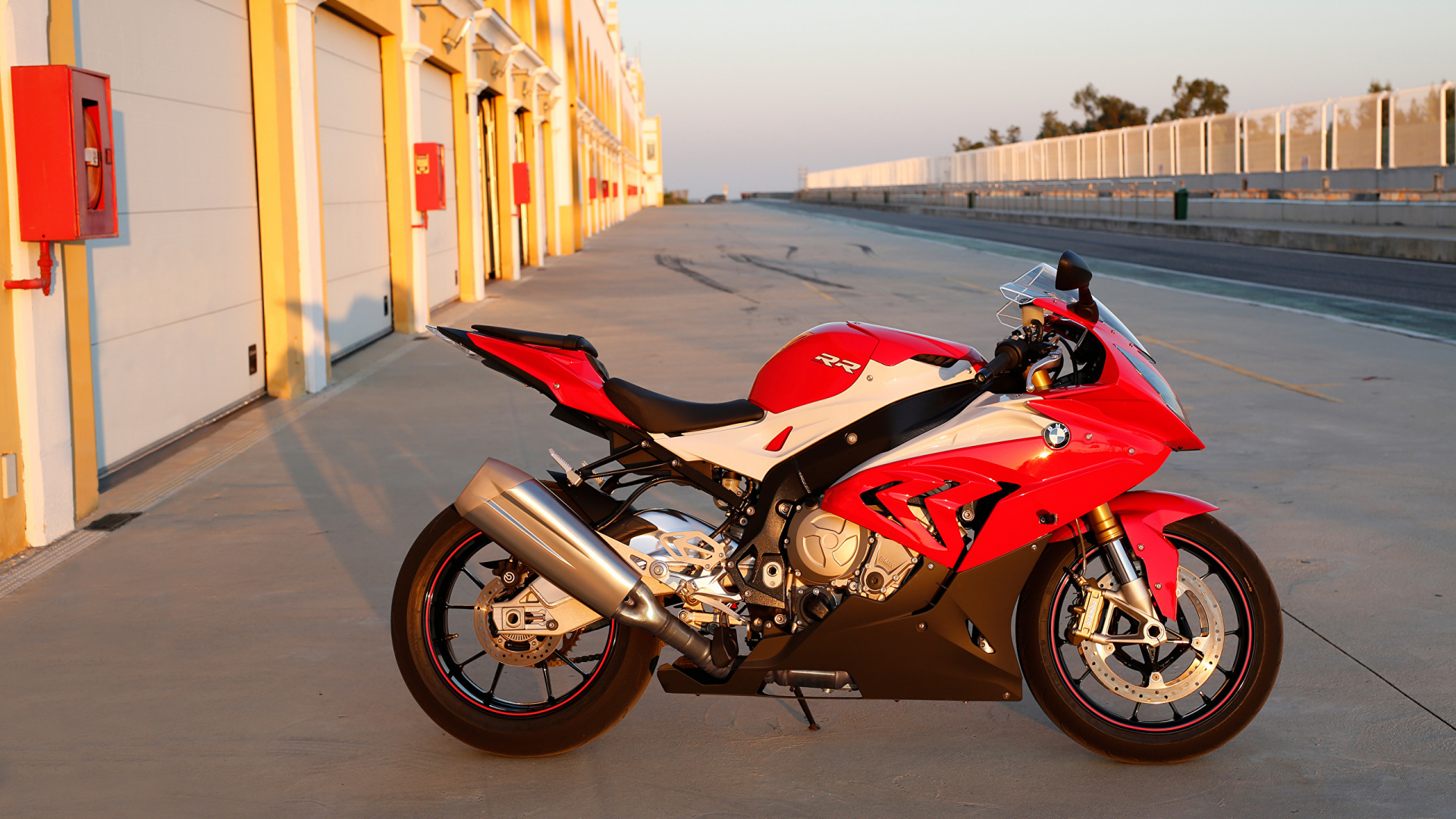 Red and Black Sports Bike Parked on The Side of The Road During Daytime. Wallpaper in 1920x1080 Resolution