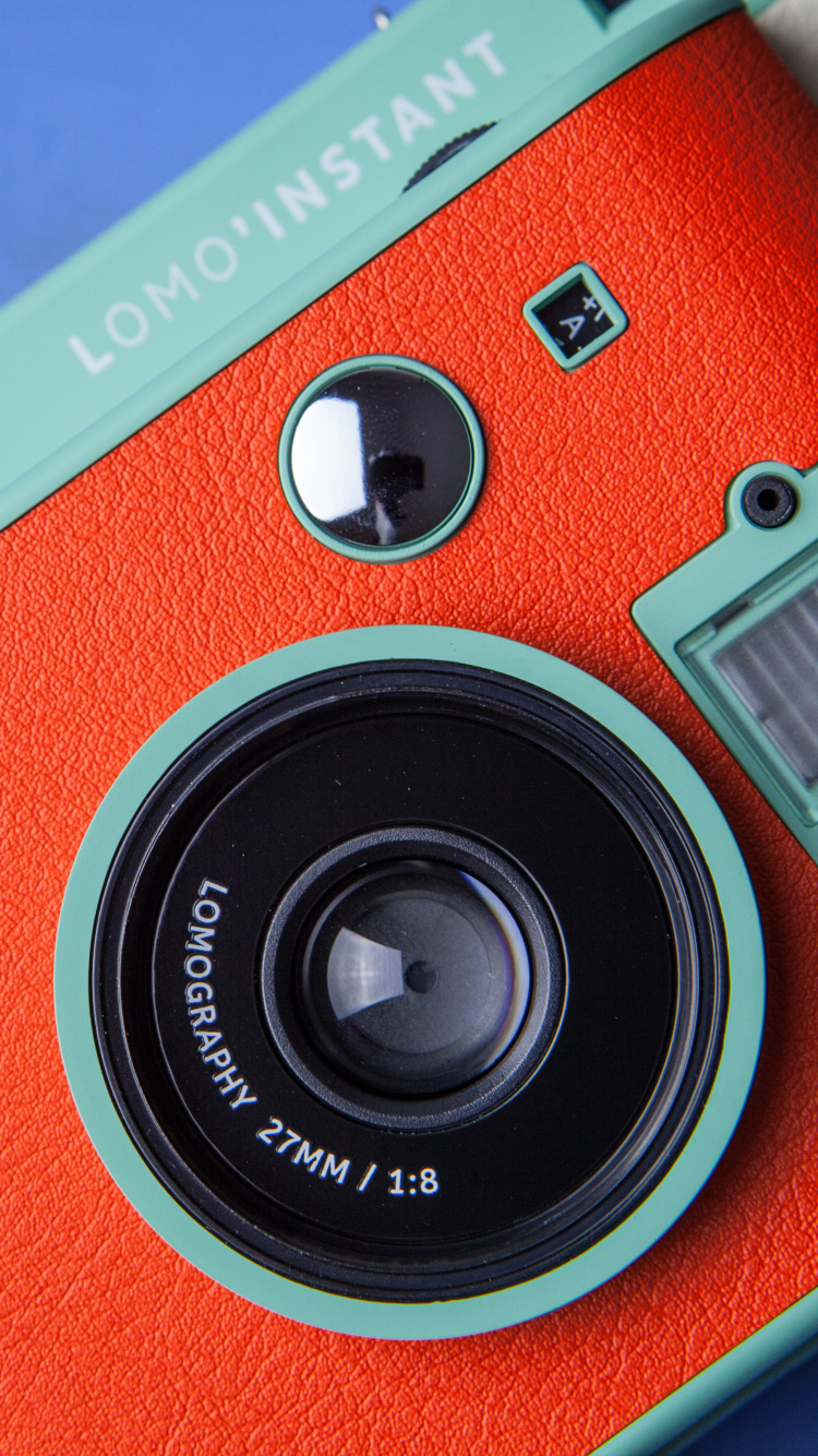 Red and Silver Camera on White Table. Wallpaper in 750x1334 Resolution