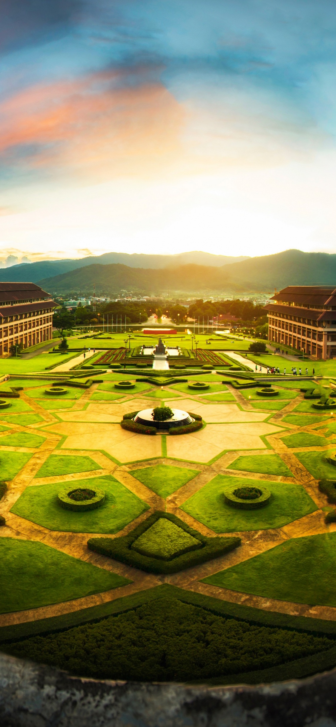 Green and Brown Field Under Blue Sky During Daytime. Wallpaper in 1125x2436 Resolution