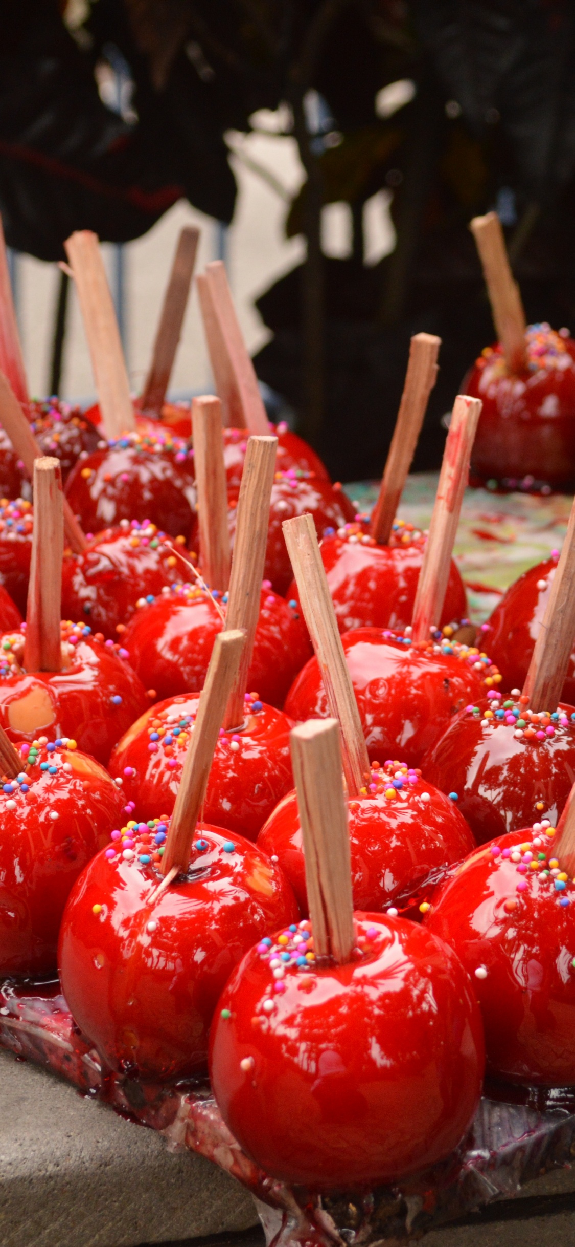 Red and White Stick Candles. Wallpaper in 1125x2436 Resolution