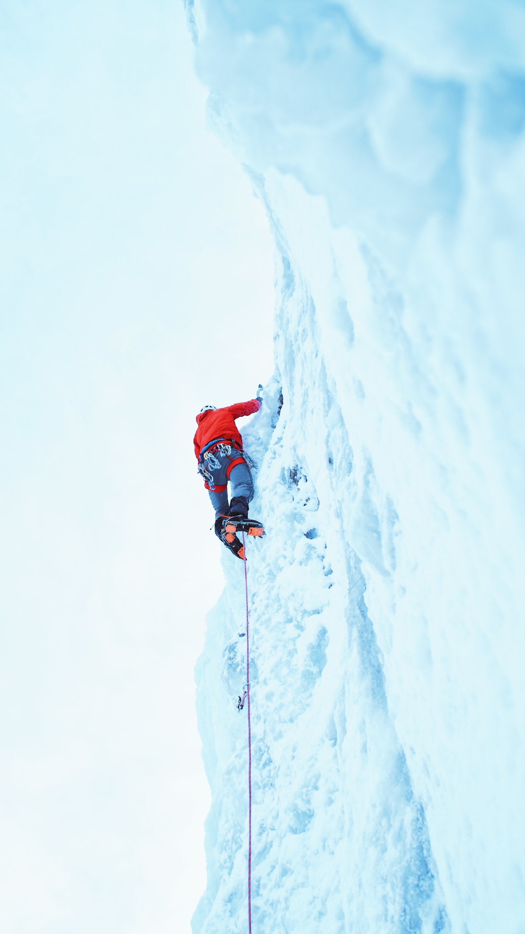 Person in Roter Jacke Und Blauer Hose Auf Schneebedeckten Bergen Tagsüber. Wallpaper in 1080x1920 Resolution