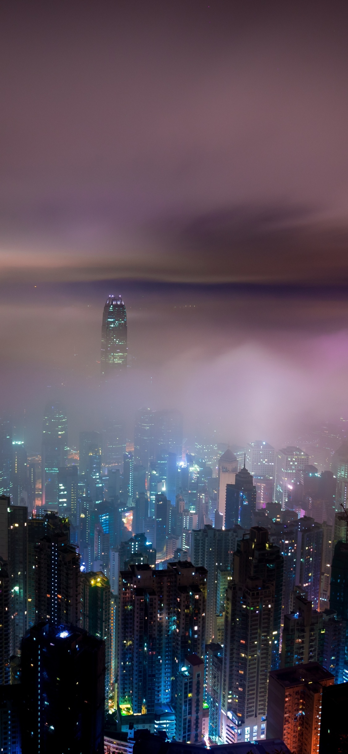 City Skyline During Night Time. Wallpaper in 1125x2436 Resolution