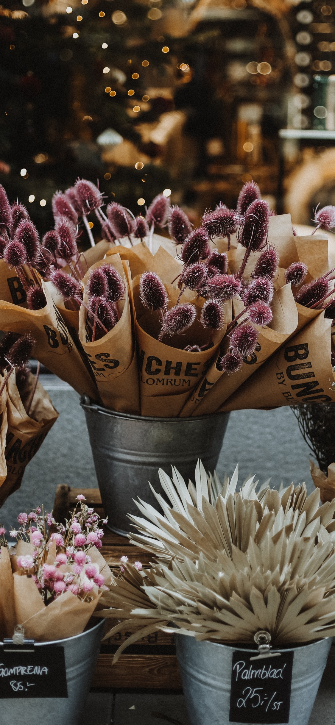 Brown Ice Cream Cone With Purple Flowers. Wallpaper in 1125x2436 Resolution