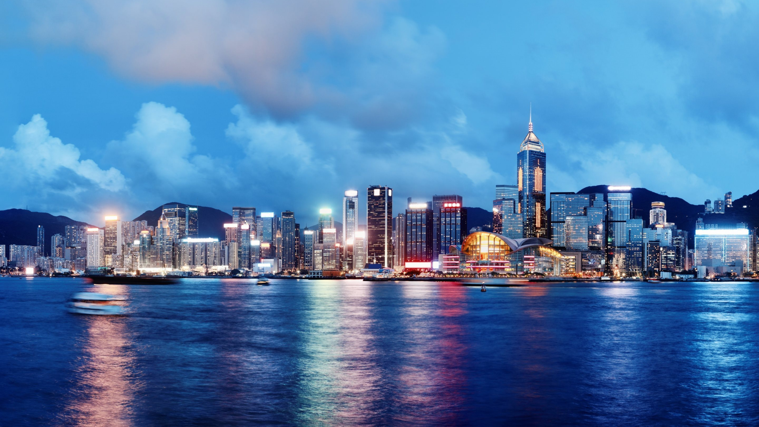 City Skyline Across Body of Water During Daytime. Wallpaper in 2560x1440 Resolution