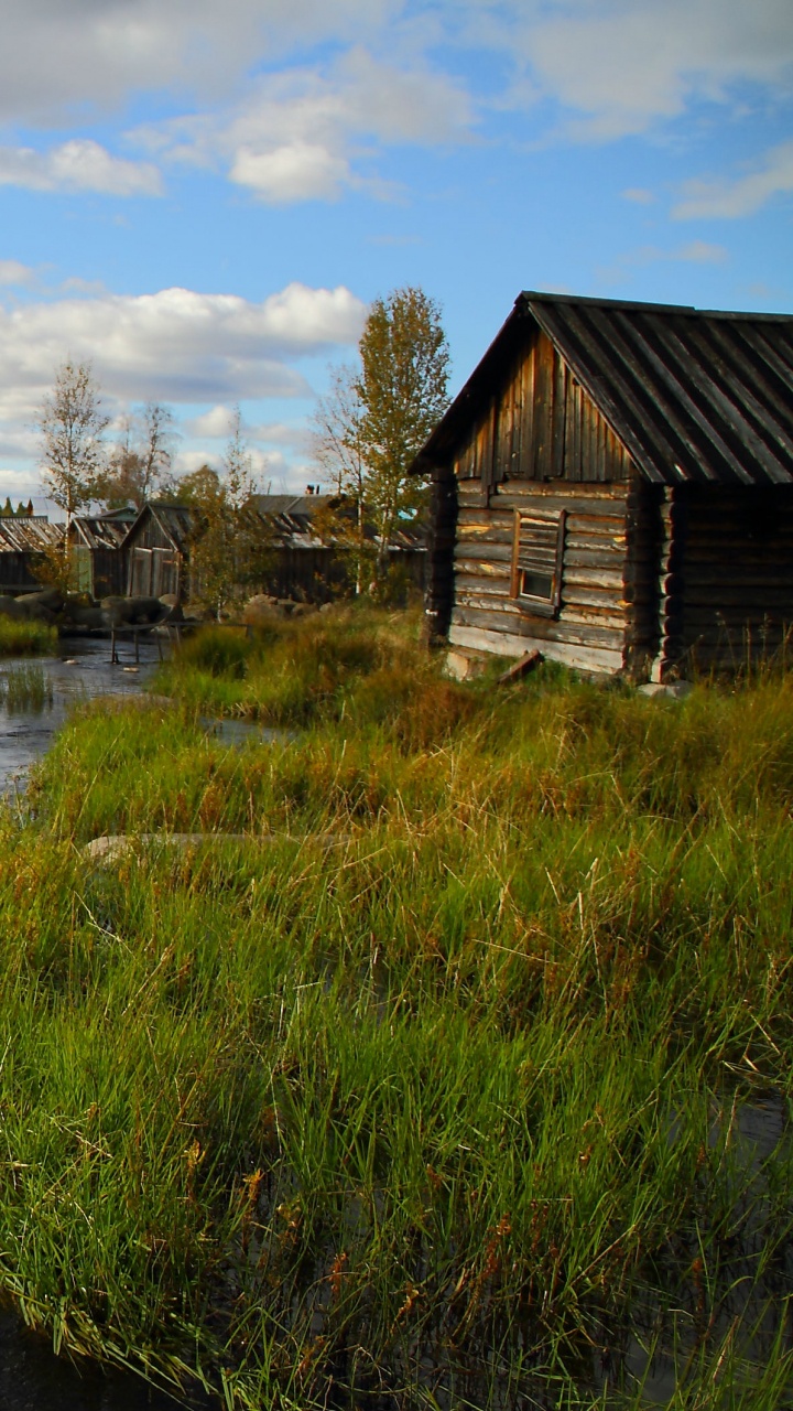 Green Grass Field Near River Under Blue Sky During Daytime. Wallpaper in 720x1280 Resolution