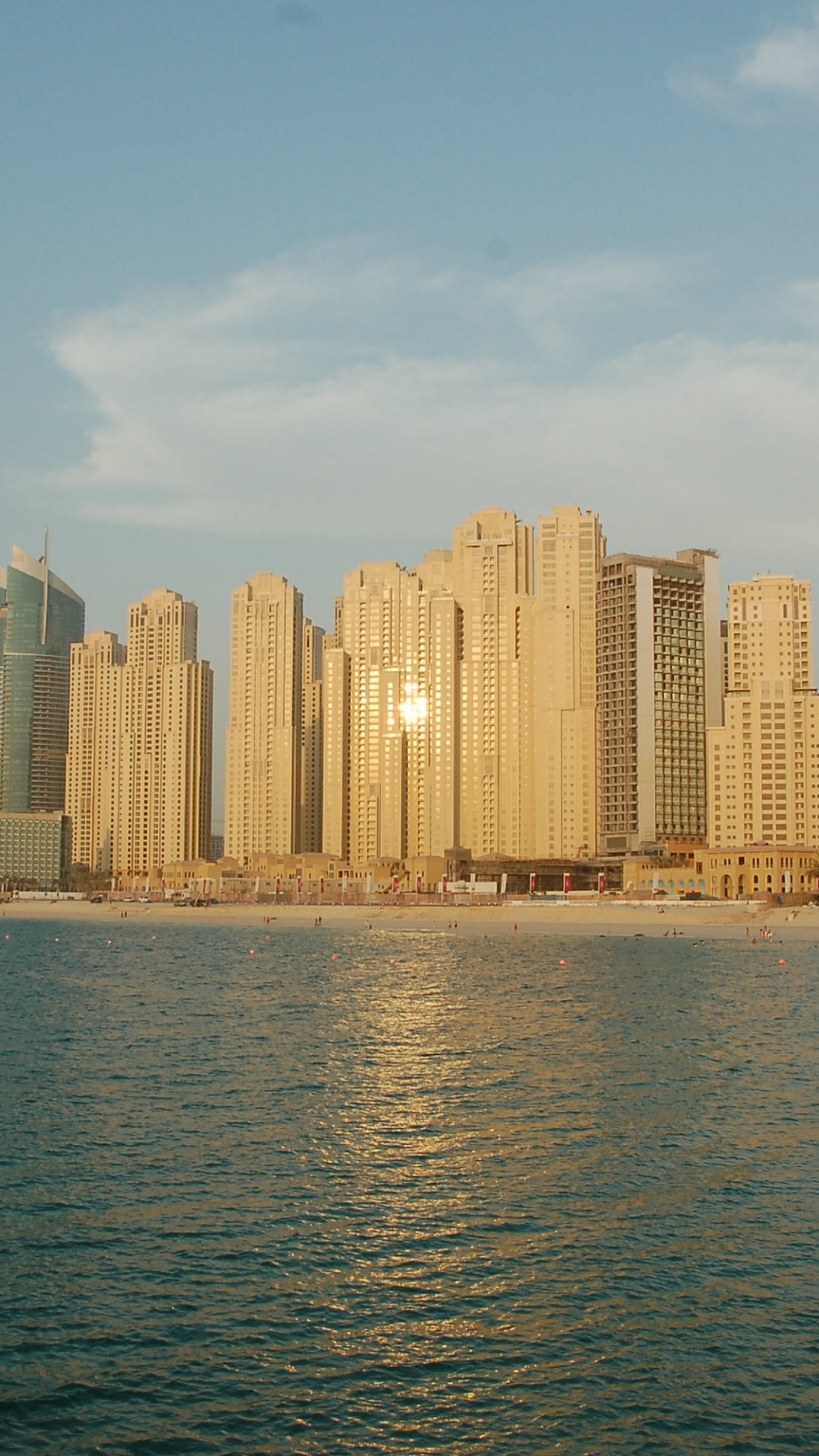 City Skyline Across Body of Water During Daytime. Wallpaper in 1080x1920 Resolution