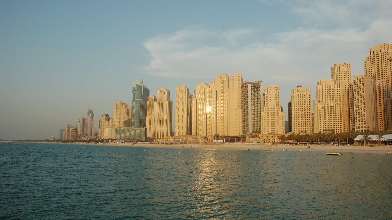 City Skyline Across Body of Water During Daytime. Wallpaper in 1280x720 Resolution