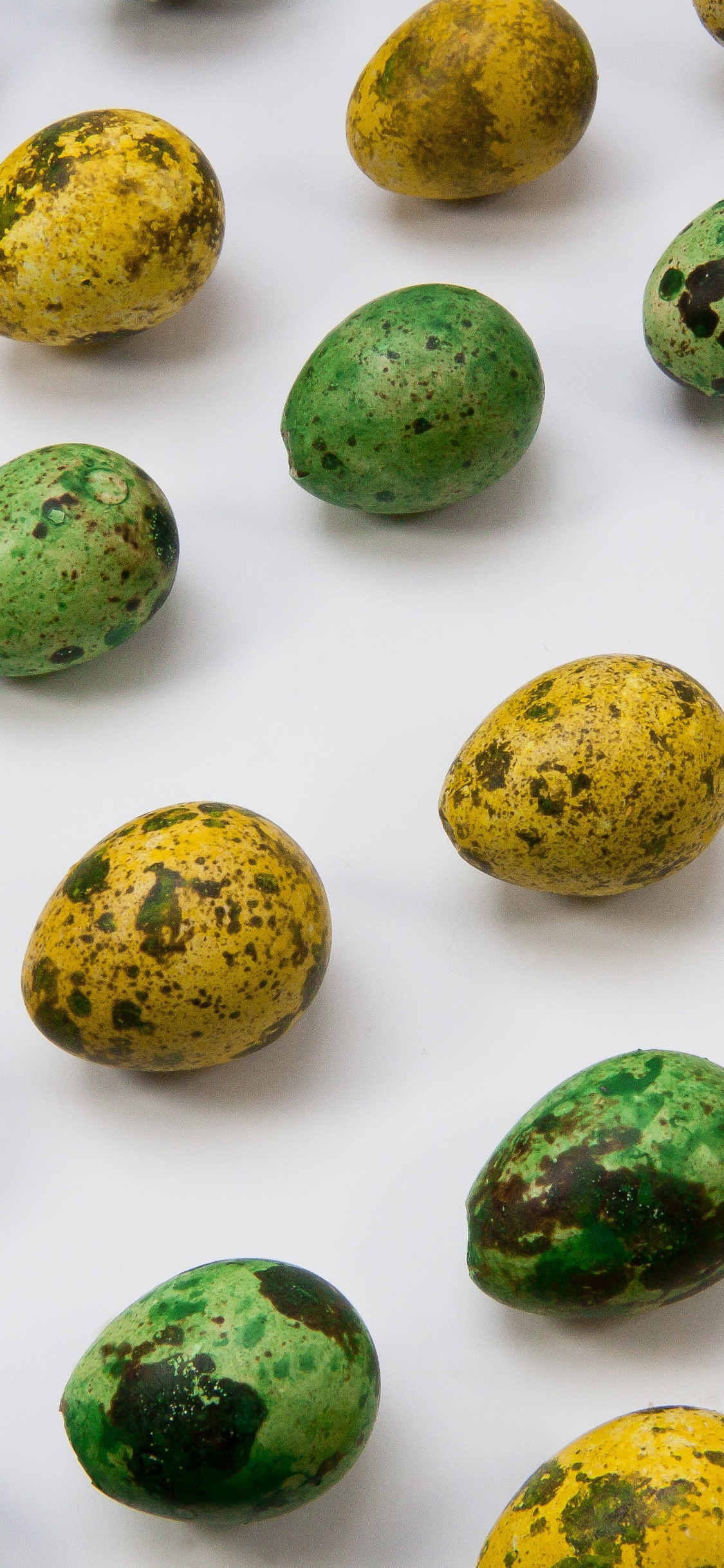 Green and Yellow Round Fruits. Wallpaper in 1125x2436 Resolution