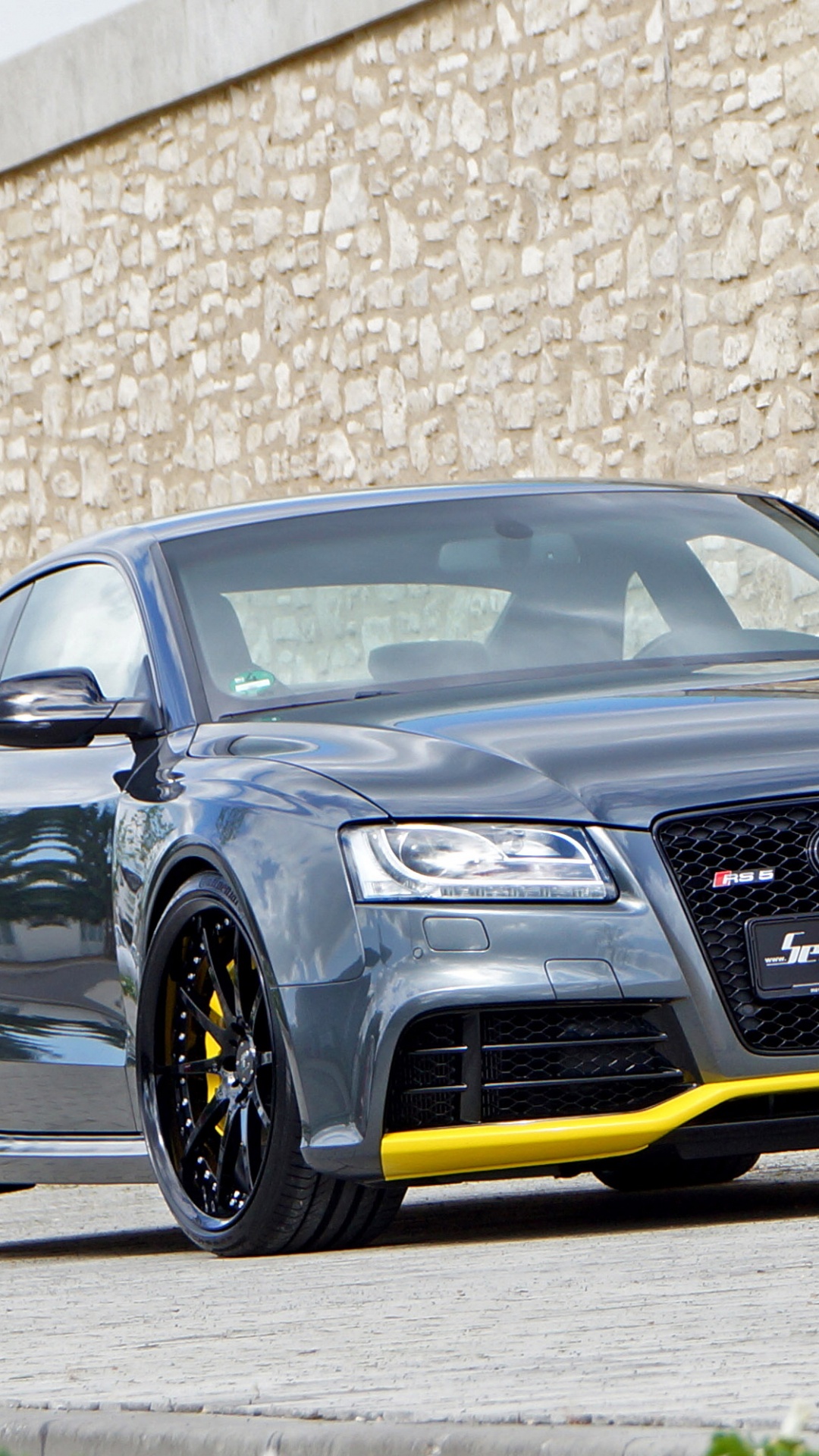 Black Audi r 8 Parked Beside Brown Brick Wall. Wallpaper in 1080x1920 Resolution