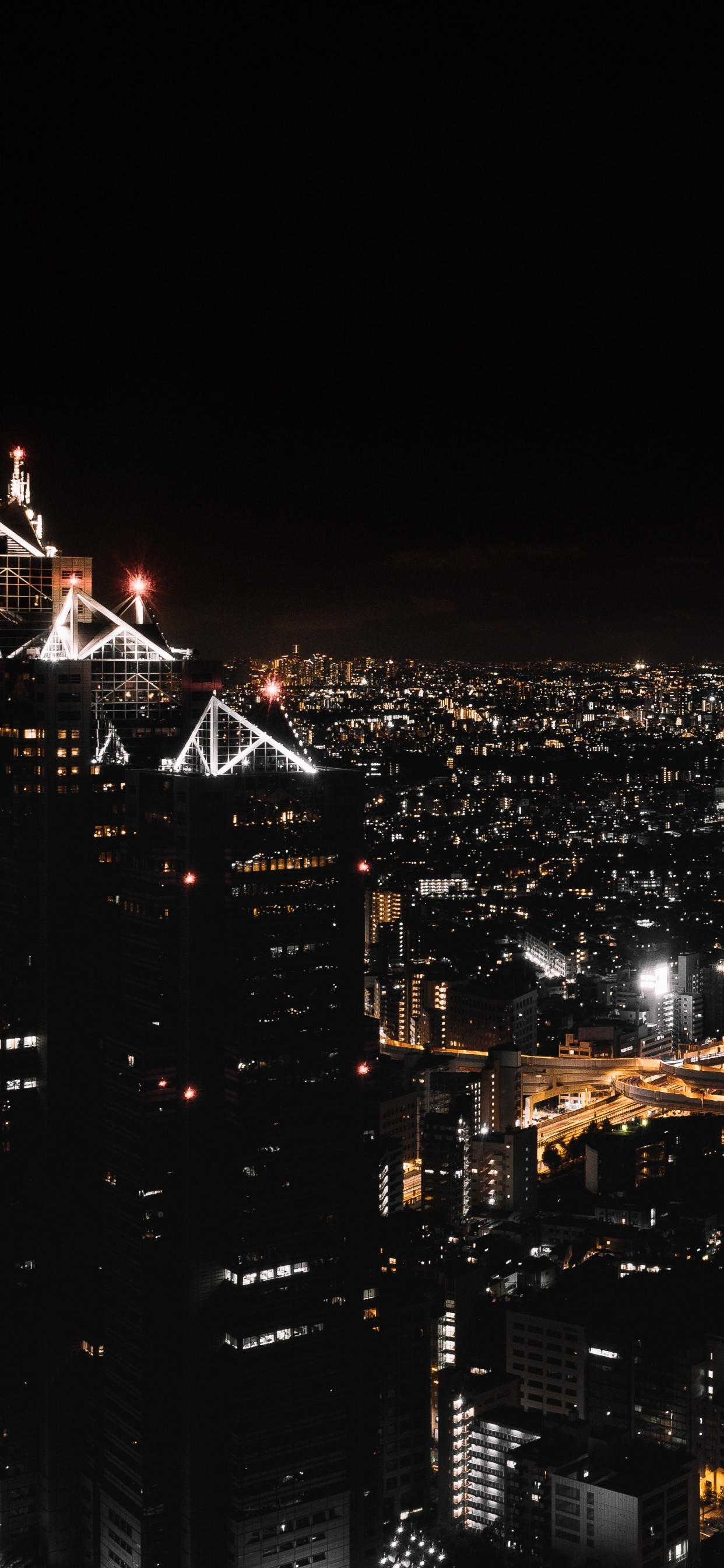 City Skyline During Night Time. Wallpaper in 1242x2688 Resolution