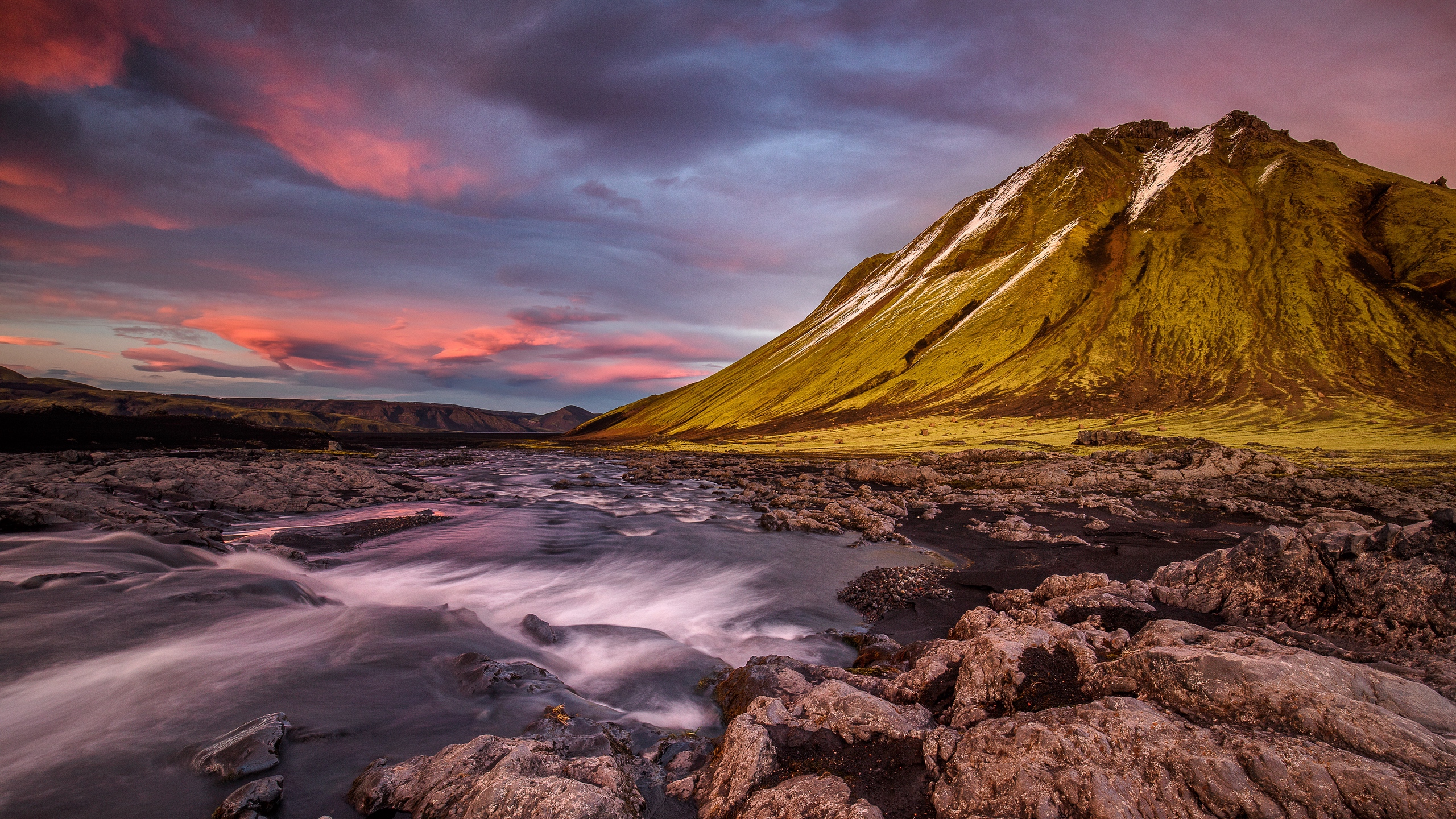 Brown Mountain Near Body of Water Under Cloudy Sky During Daytime. Wallpaper in 2560x1440 Resolution