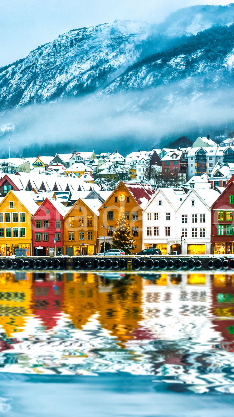 Houses Near Body of Water and Mountain. Wallpaper in 750x1334 Resolution