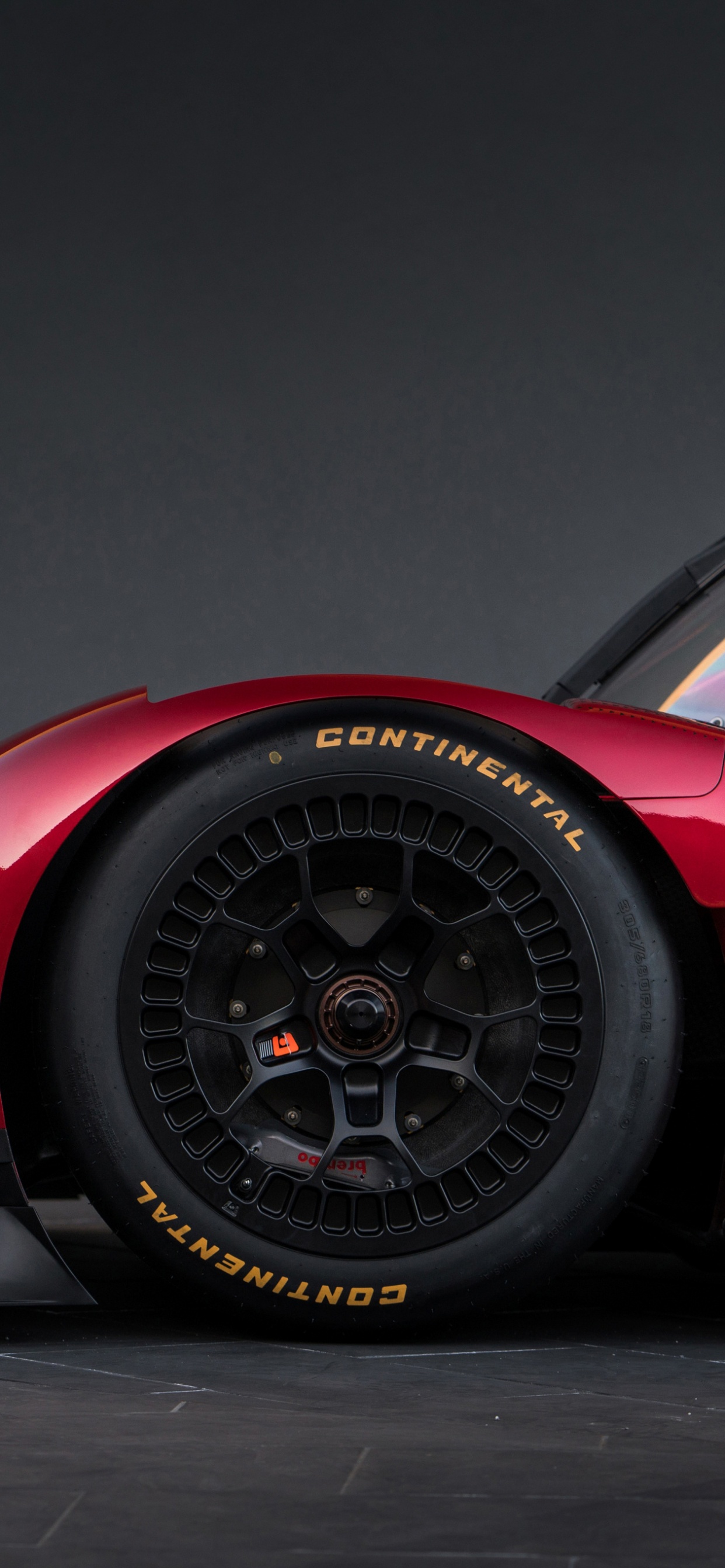 Coche Deportivo Ferrari Rojo Sobre Fondo Negro. Wallpaper in 1242x2688 Resolution