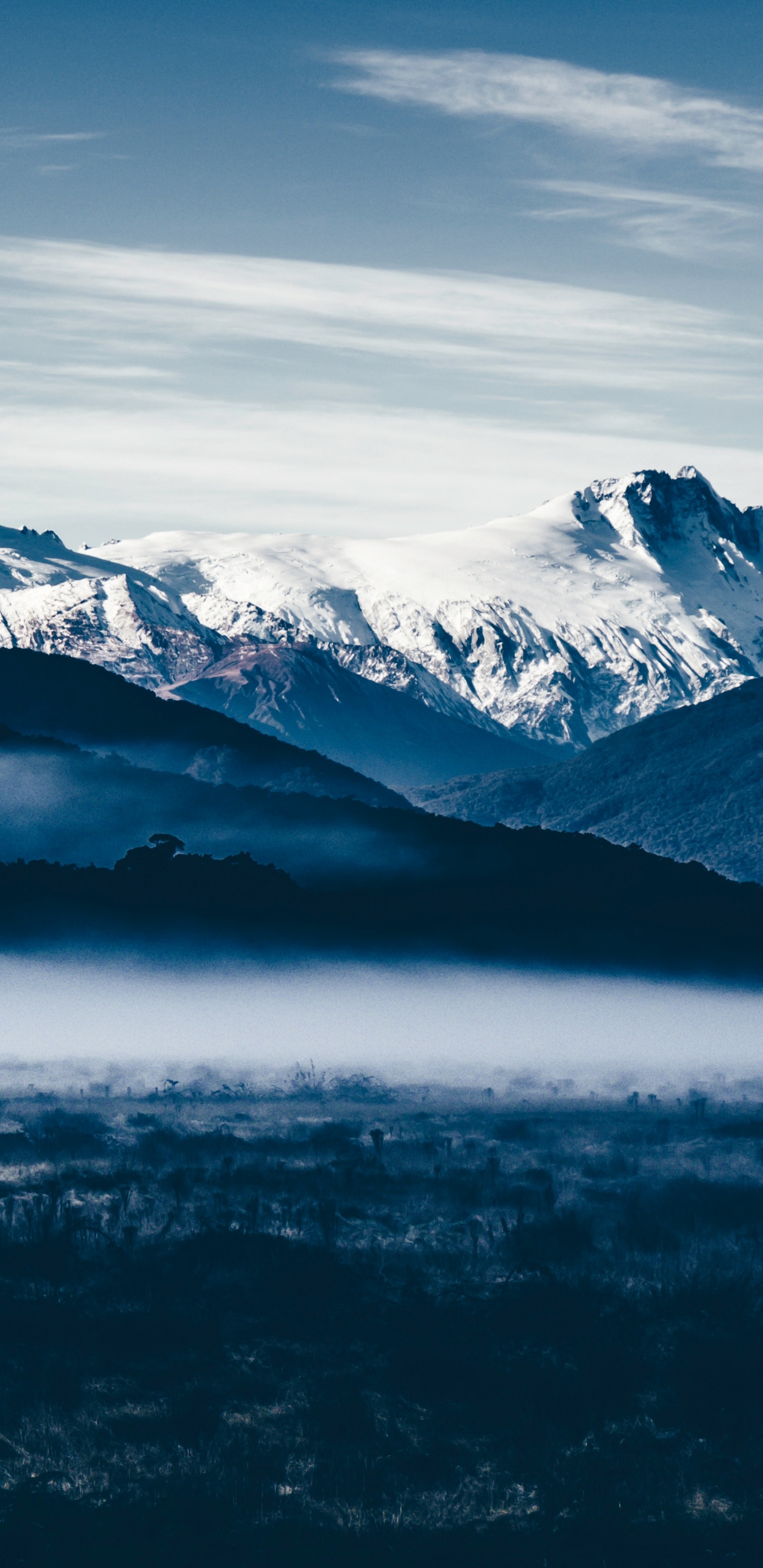 Snow Covered Mountains Under Cloudy Sky During Daytime. Wallpaper in 1440x2960 Resolution