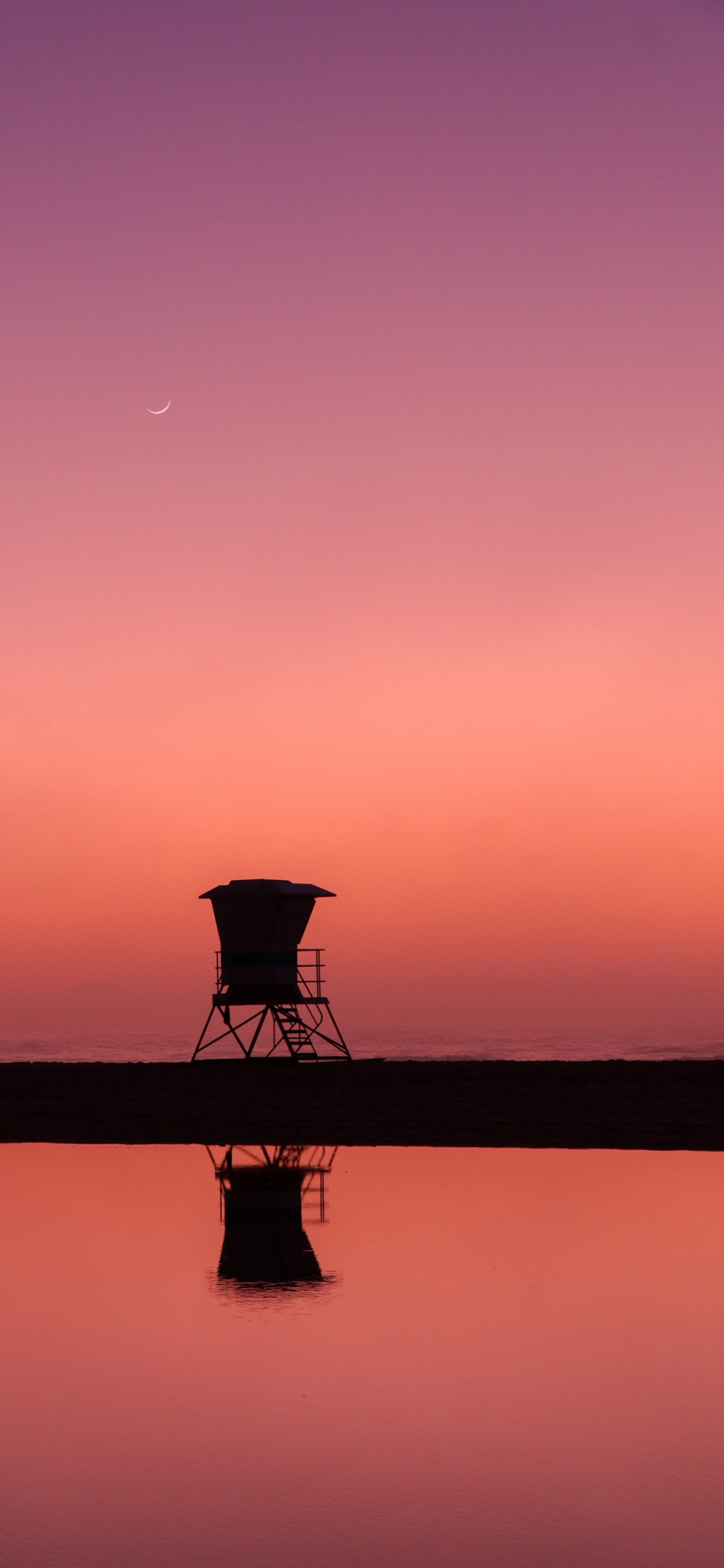 Silhouette Einer Person, Die Während Des Sonnenuntergangs Auf Dem Dock Steht. Wallpaper in 1125x2436 Resolution