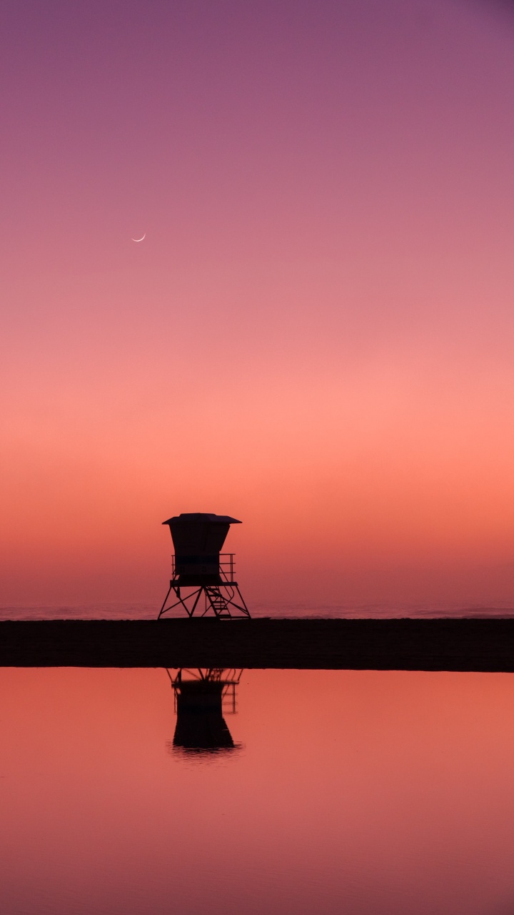 Silhouette of Person Standing on Dock During Sunset. Wallpaper in 720x1280 Resolution