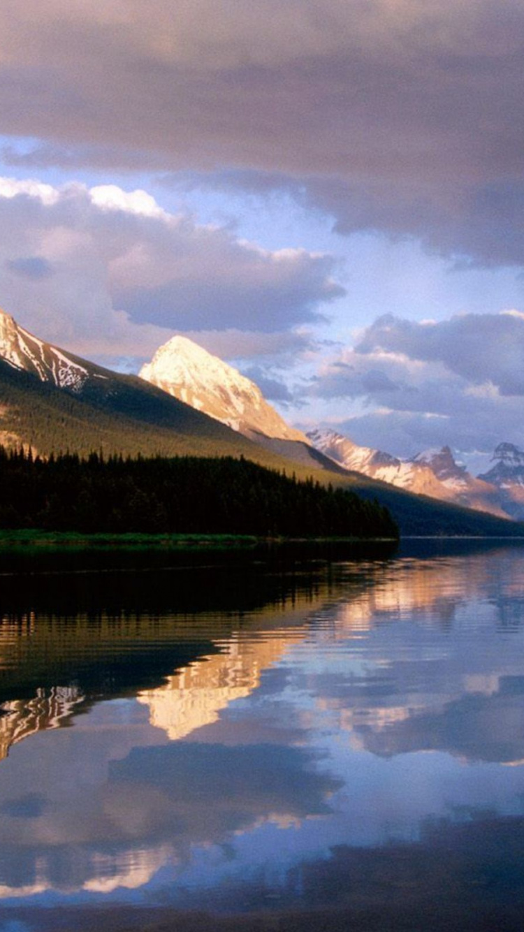 Brown Wooden House Near Lake and Mountains Under White Clouds and Blue Sky During Daytime. Wallpaper in 750x1334 Resolution