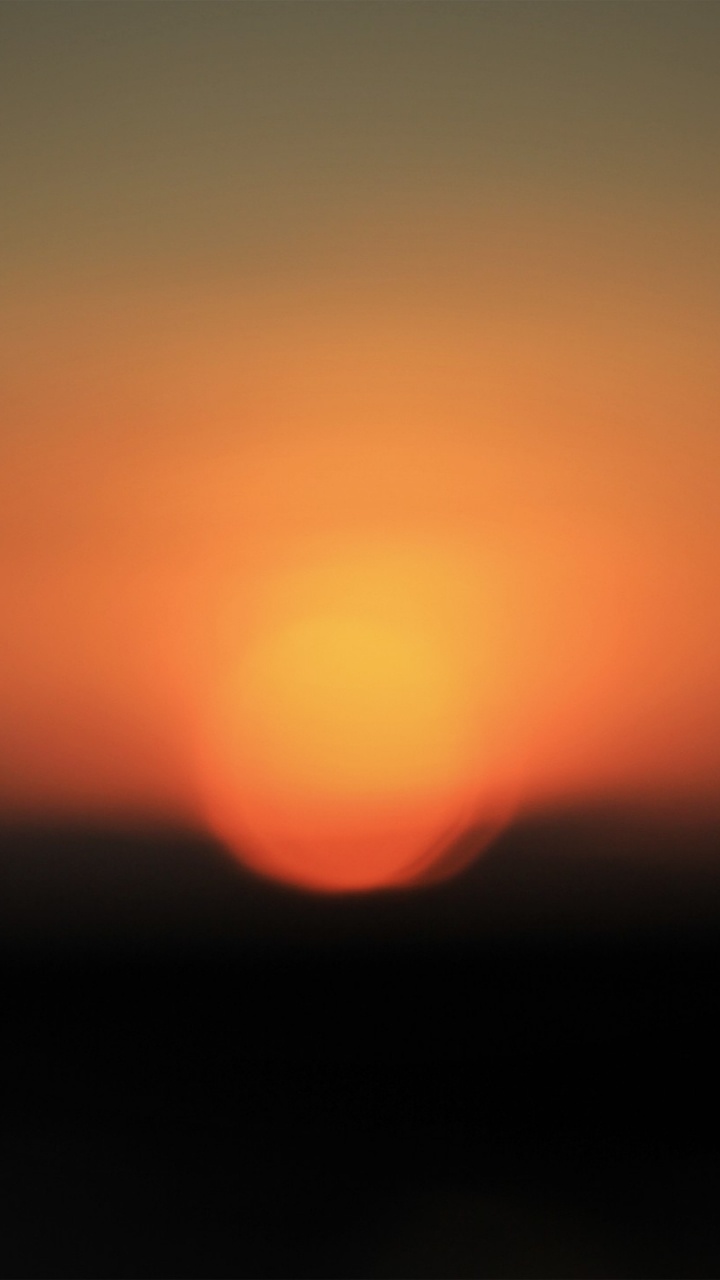 Sol Naranja y Negro en el Cielo. Wallpaper in 720x1280 Resolution